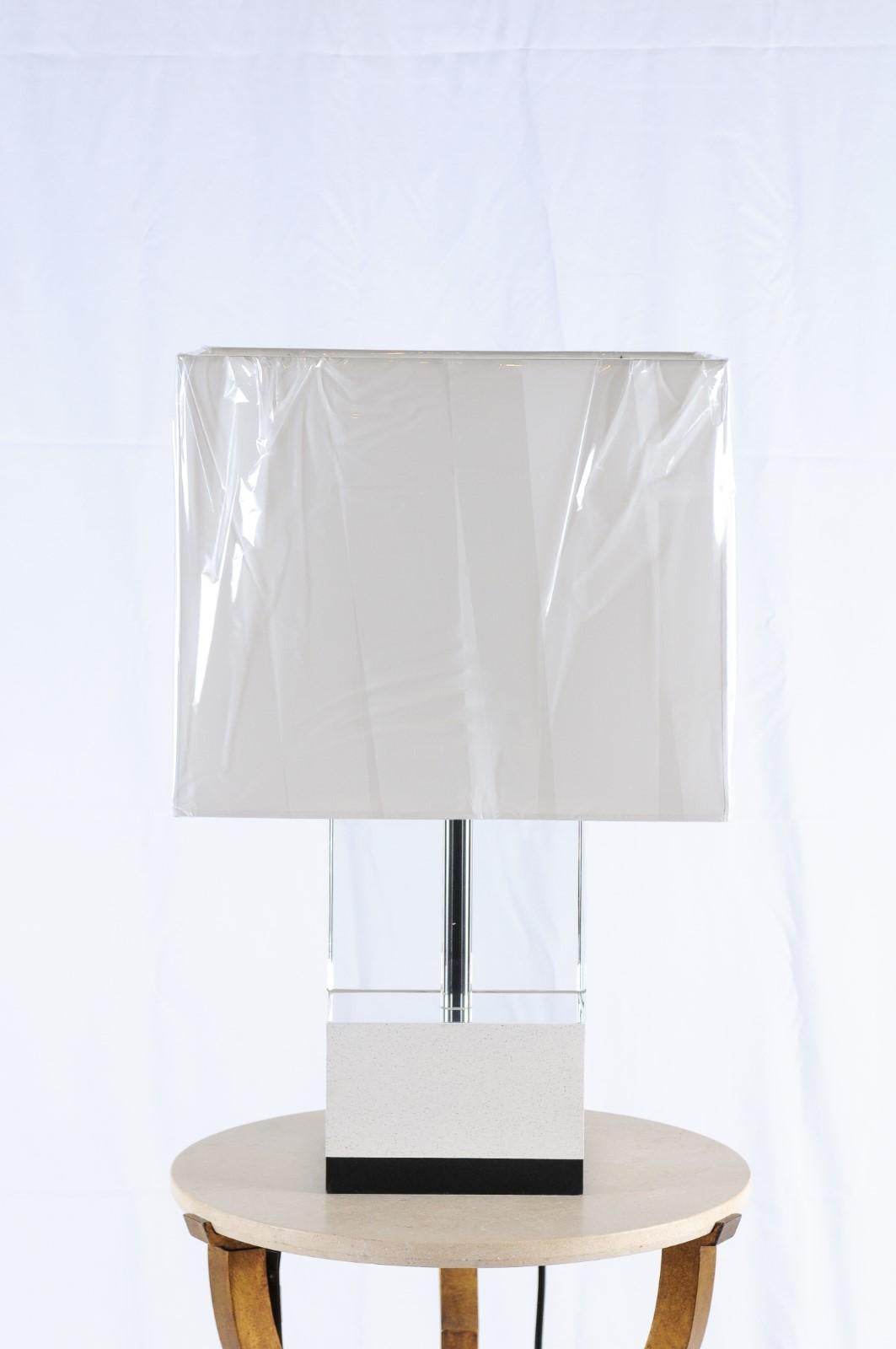 Lasting in it's simplicity, the Baker Glacier table lamp is a mixes glass, plaster and steel in a contemporary rectangle that's sleek and sophisticated for any interior.