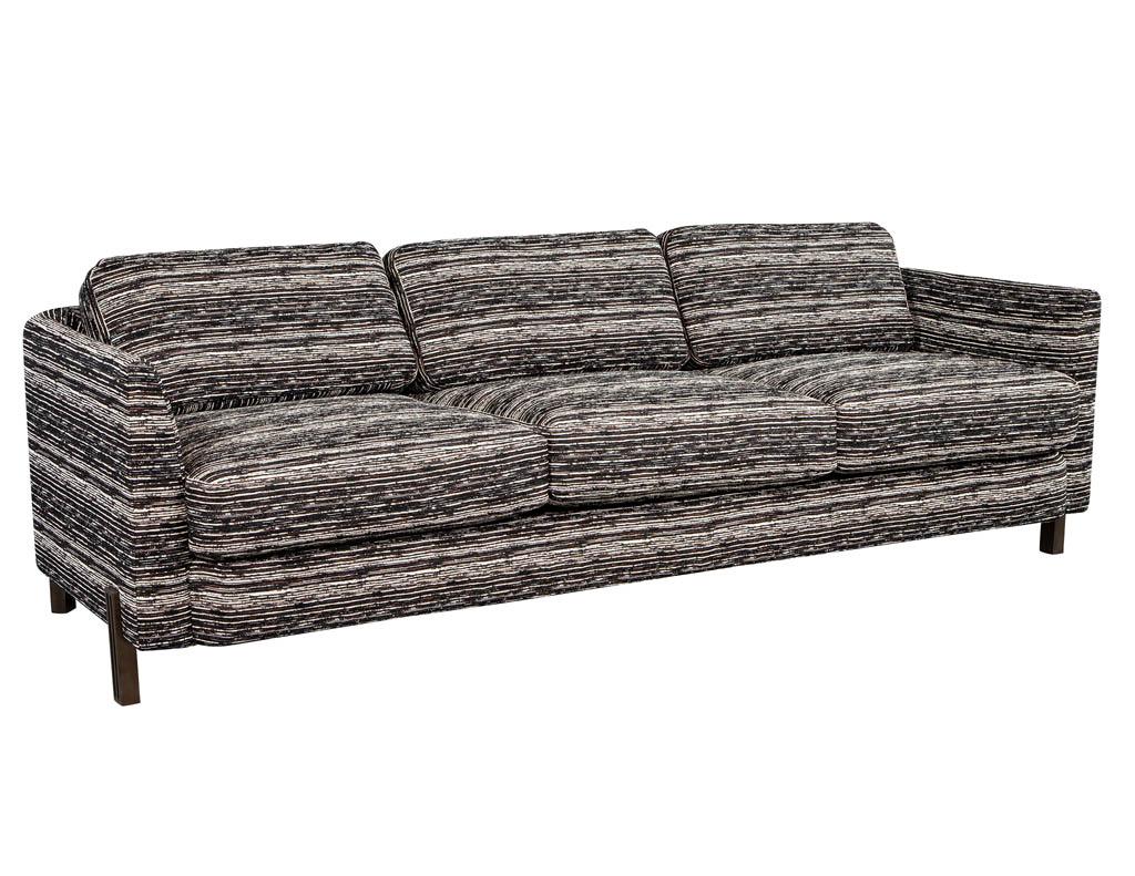 Milling Road modern sofa for Baker by Kara Mann. Antique bronze metal fluted legs on a flowing curved sofa in original Baker fabric.
Price includes complimentary curb side delivery to the continental USA.