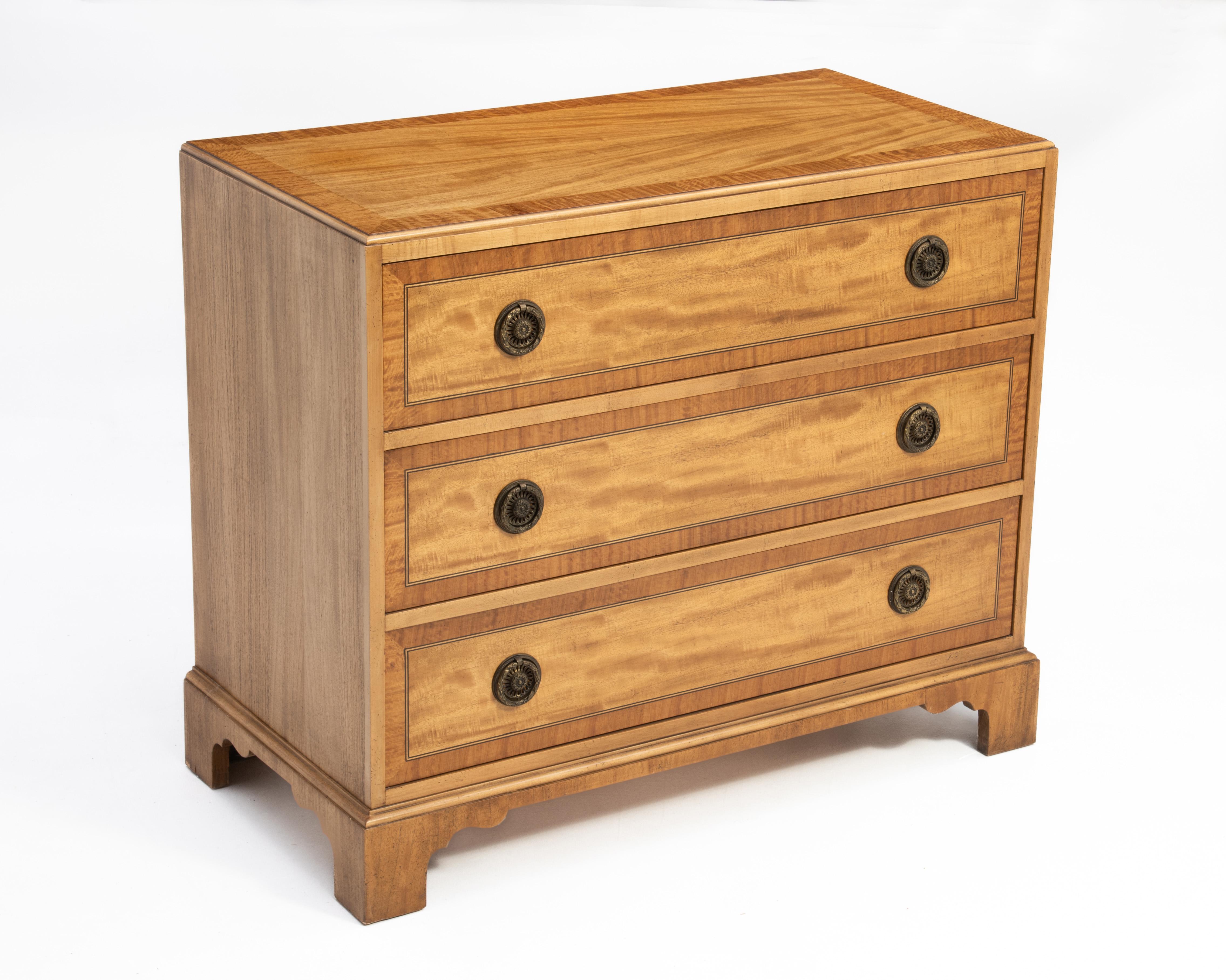 A banded mahogany, striped maple and satinwood bachelors chest by Milling Road Furniture, a division of the Baker Furniture. Fully Marked, the chest will serve equally well in a living room, dining room or bedroom.
The dimensions of the top are D