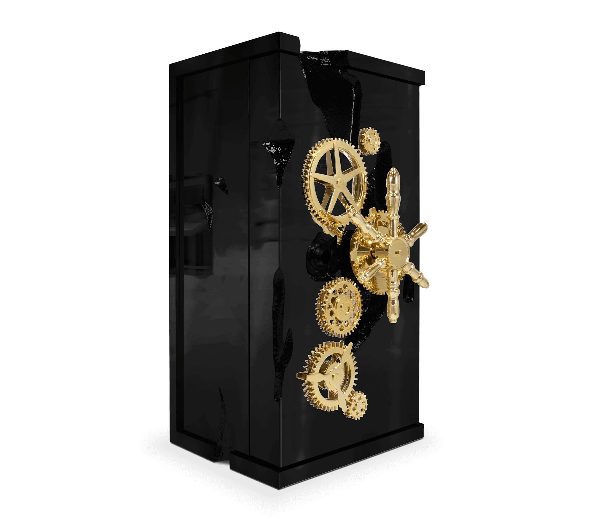 Influenced by the California Gold Rush, the Millionaire Safe is a statement piece designed to cause an impression. Enveloped by gold-plated polished brass frame with several dents, it sparks both interest and imagination reminding the vault robbery