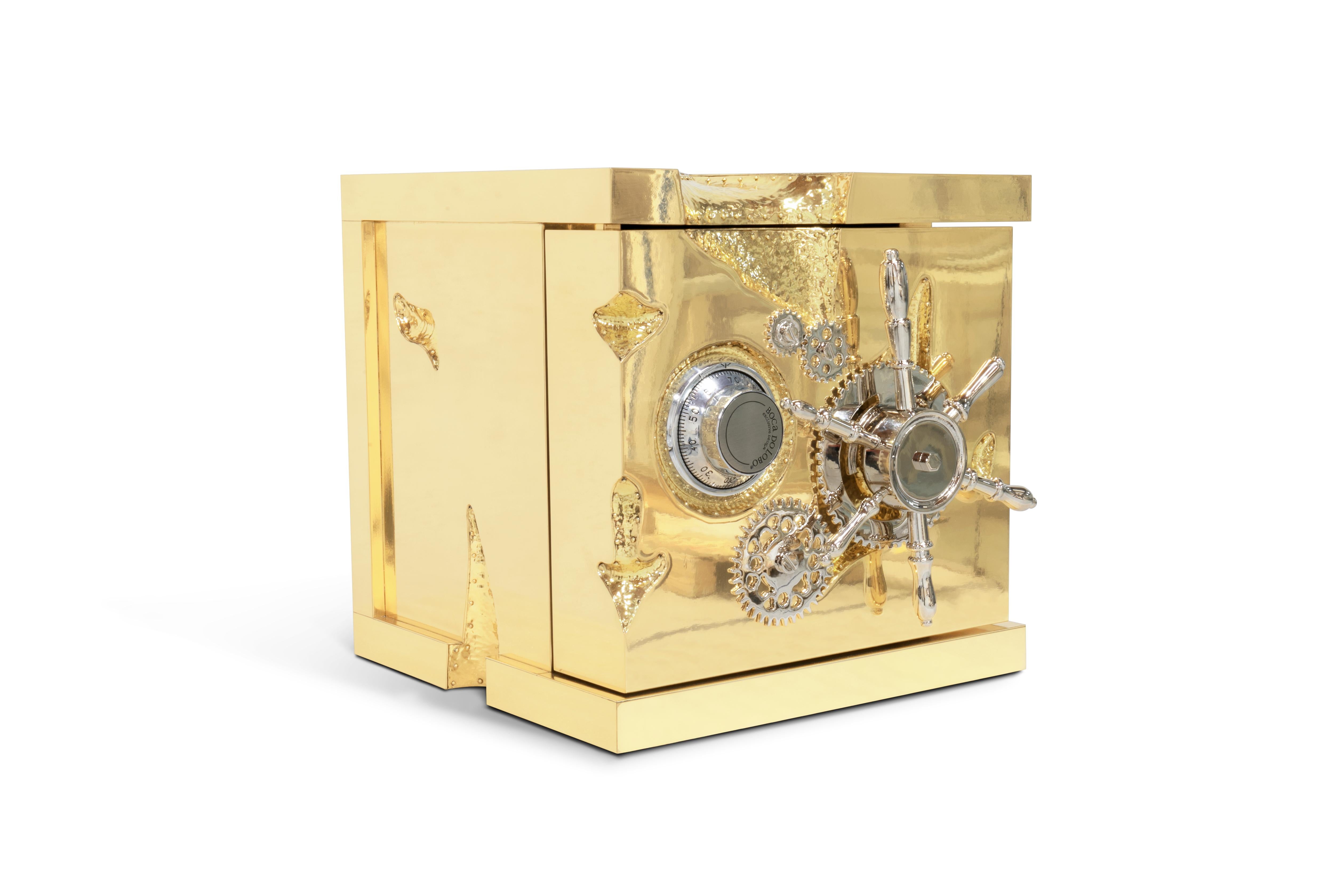 The Millionaire Jewelry Safe - a compact and portable rendition of the iconic Millionaire Safe. Inspired by the allure of the California Gold Rush, this statement piece exudes a captivating charm. Crafted with exquisite materials, and adorned with