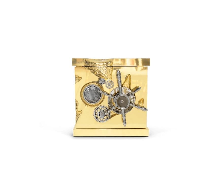 A small and portable version of the Millionaire Safe, the Millionaire Jewelry Safe is a statement piece influenced by the California Gold Rush and designed to cause an impression. Built-in a gold-plated polished brass frame with dents that spark