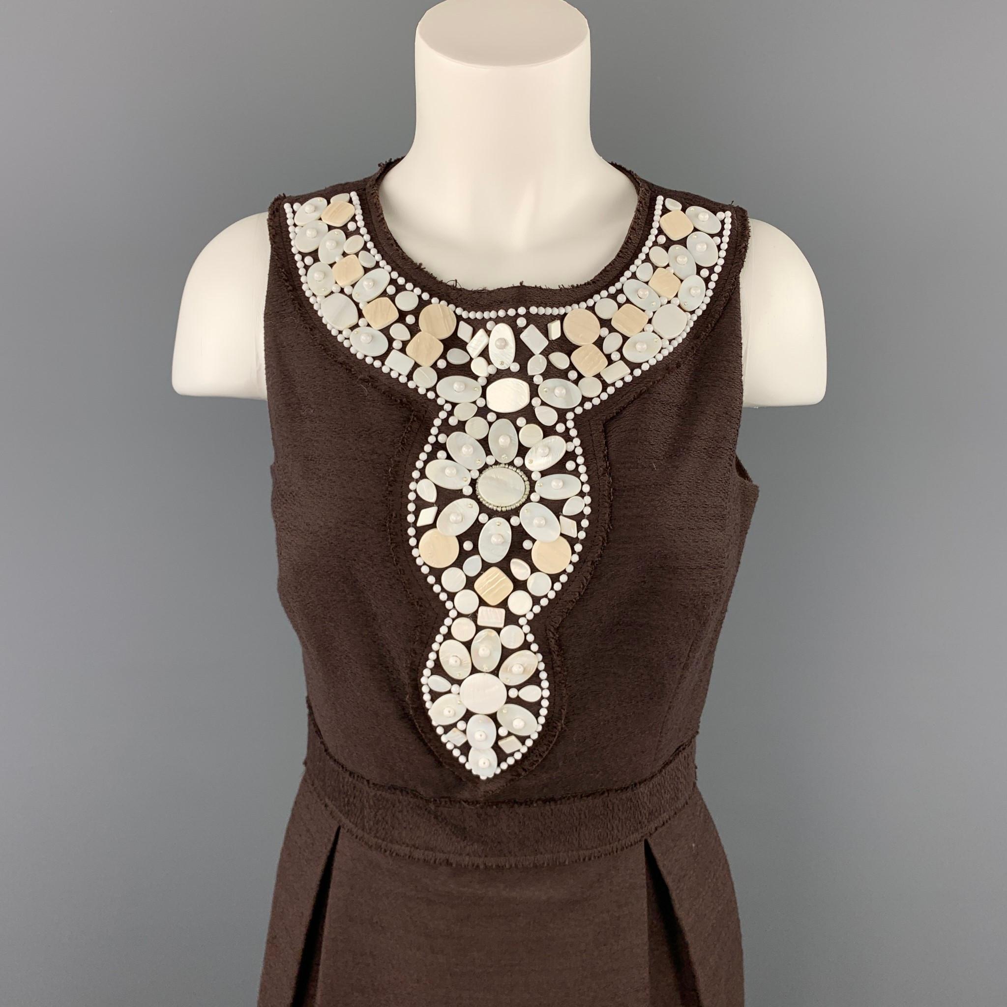 MILLY dress comes in a brown textured polyester / cotton with white beaded details featuring a sheath style, pleated, ad a back zip up closure. Made in USA.

Very Good Pre-Owned Condition.
Marked: 6

Measurements:

Bust: 31 in. 
Waist: 28 in. 
Hip: