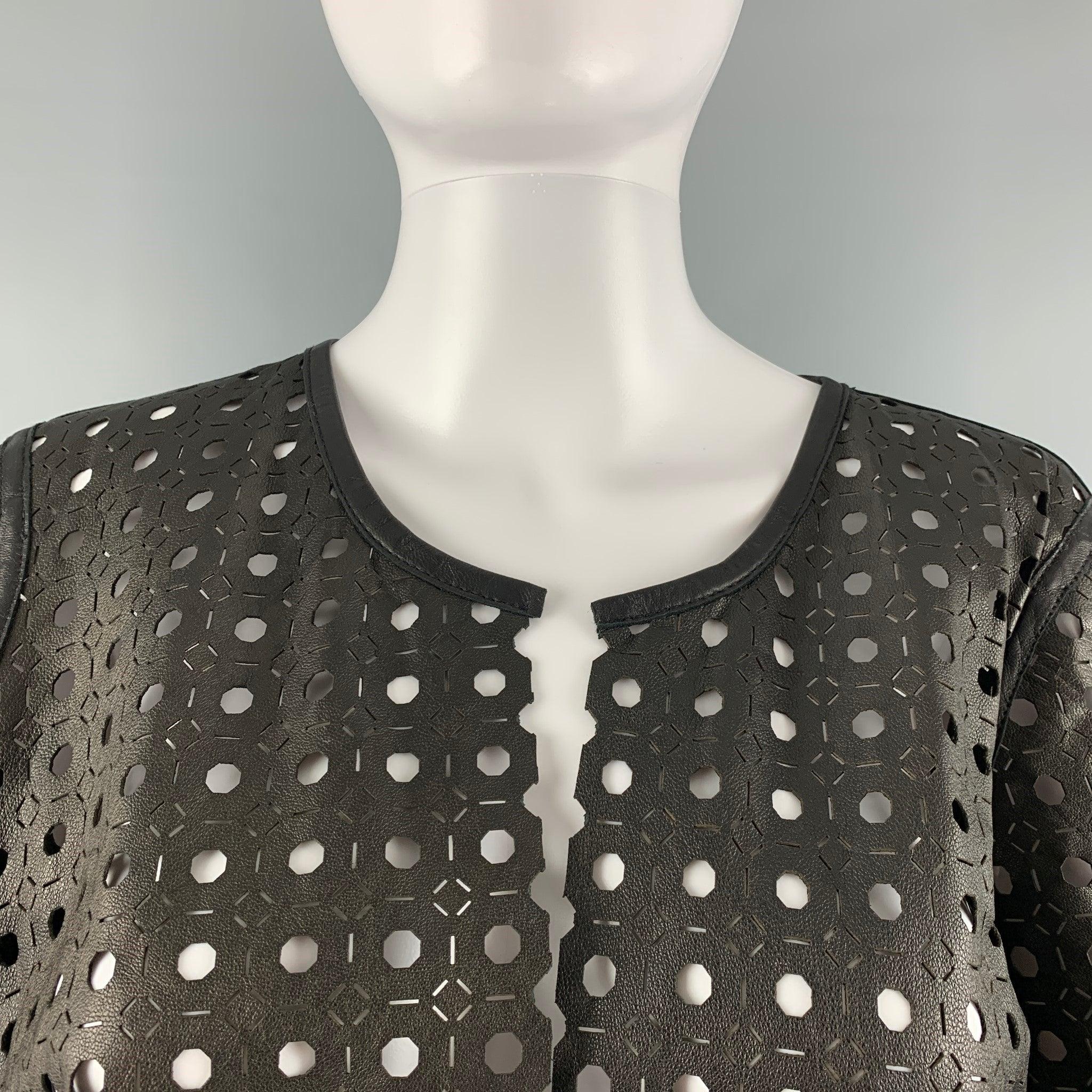 MILLY cropped jacket comes in a black lamb skin leather featuring laser cut texture, 3/4 sleeves and an open front closure. Made in USA.Excellent Pre-Owned Condition. 

Marked:   M 

Measurements: 
 
Shoulder: 16 inches  Bust: 38 inches  Sleeve: 15