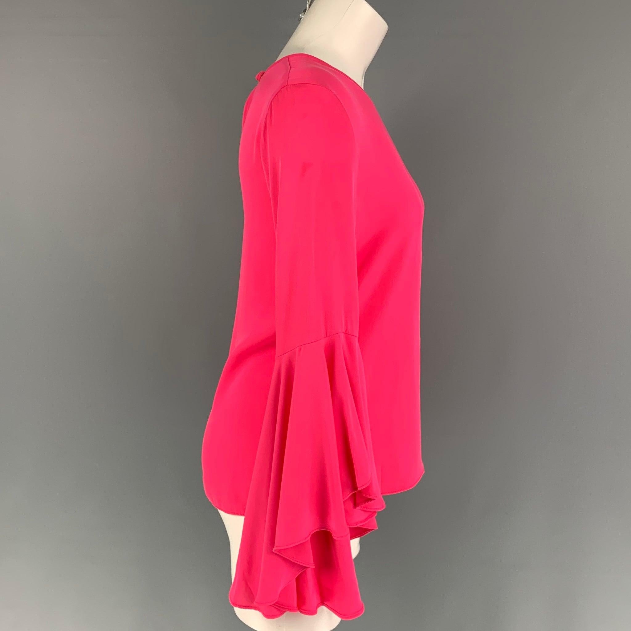 MILLY blouse comes in a pink silk featuring bell sleeves, crew-neck, and a back button closure. Made in USA. Very Good
Pre-Owned Condition. Light wear.  

Marked:   2 

Measurements: 
 
Shoulder: 15 inches  Bust: 34 inches 
 Sleeve: 21.5 inches 