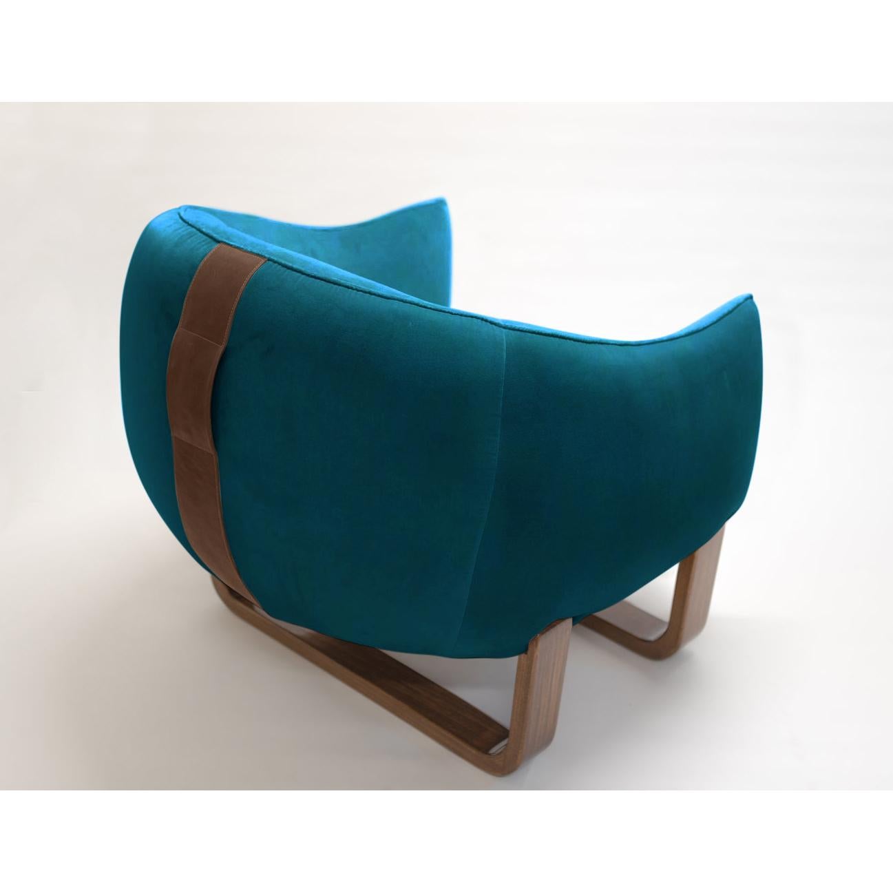 The Milo armchair features twin bentwood bases and legs in luxurious lacquer and varnished finishes, while The Milo Bean has leather accent handles for easy carrying?. The colorful, curvy duo designed by Marie Burgos can be used together with The