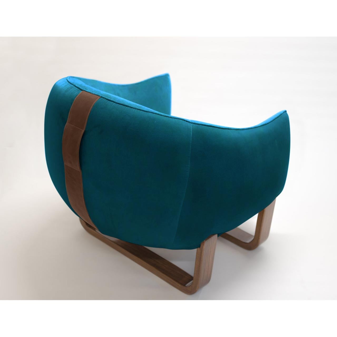 The Milo armchair features twin bentwood bases and legs in luxurious lacquer and varnished finishes, while The Milo Bean has leather accent handles for easy carrying?. The colorful, curvy duo designed by Marie Burgos can be used together with The