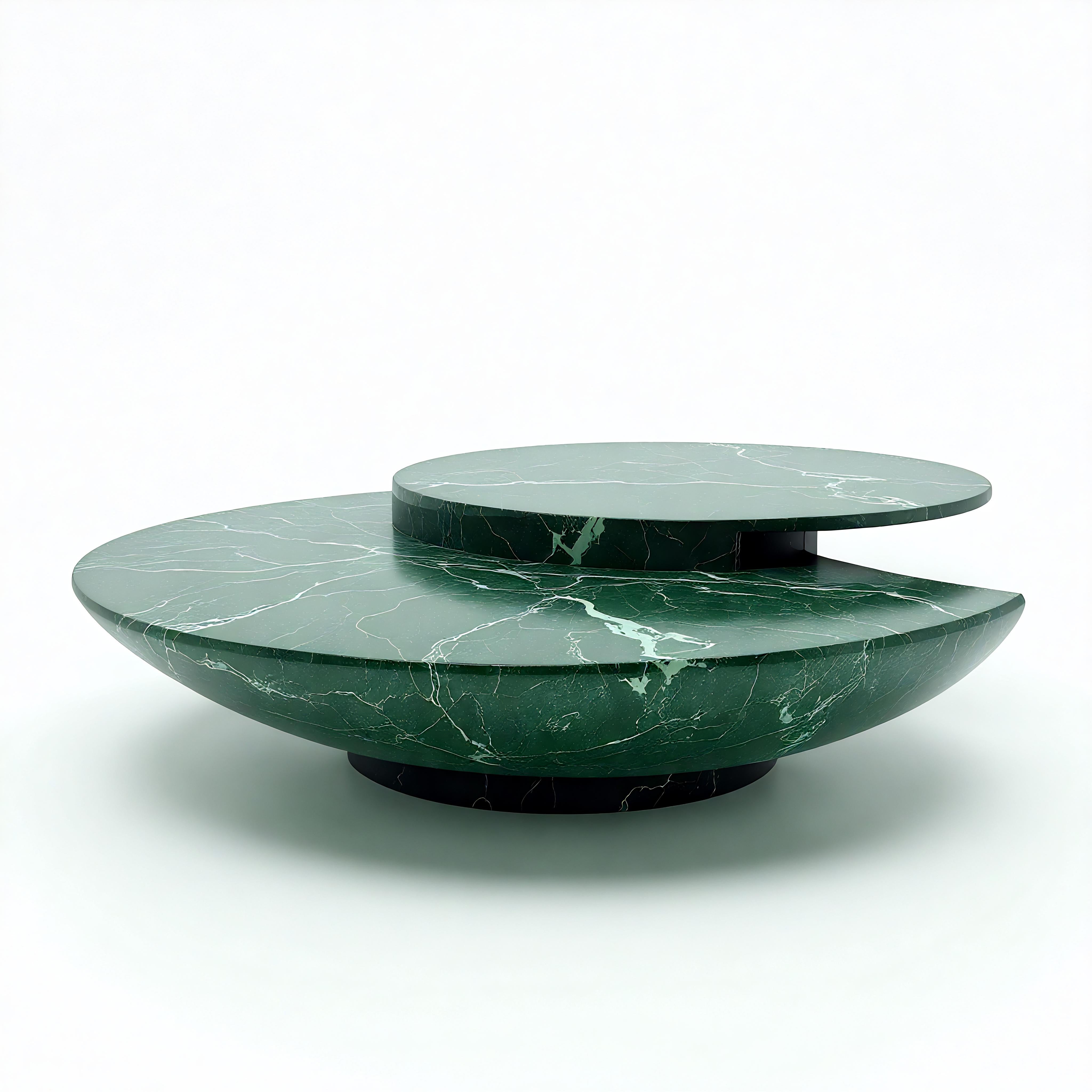 Inspired by the bold geometry and elegance of Art Deco design, this sculptural green marble coffee table is a true centerpiece. Handcrafted from luxurious Verde Alpi marble, the table features a striking round silhouette with a stepped,