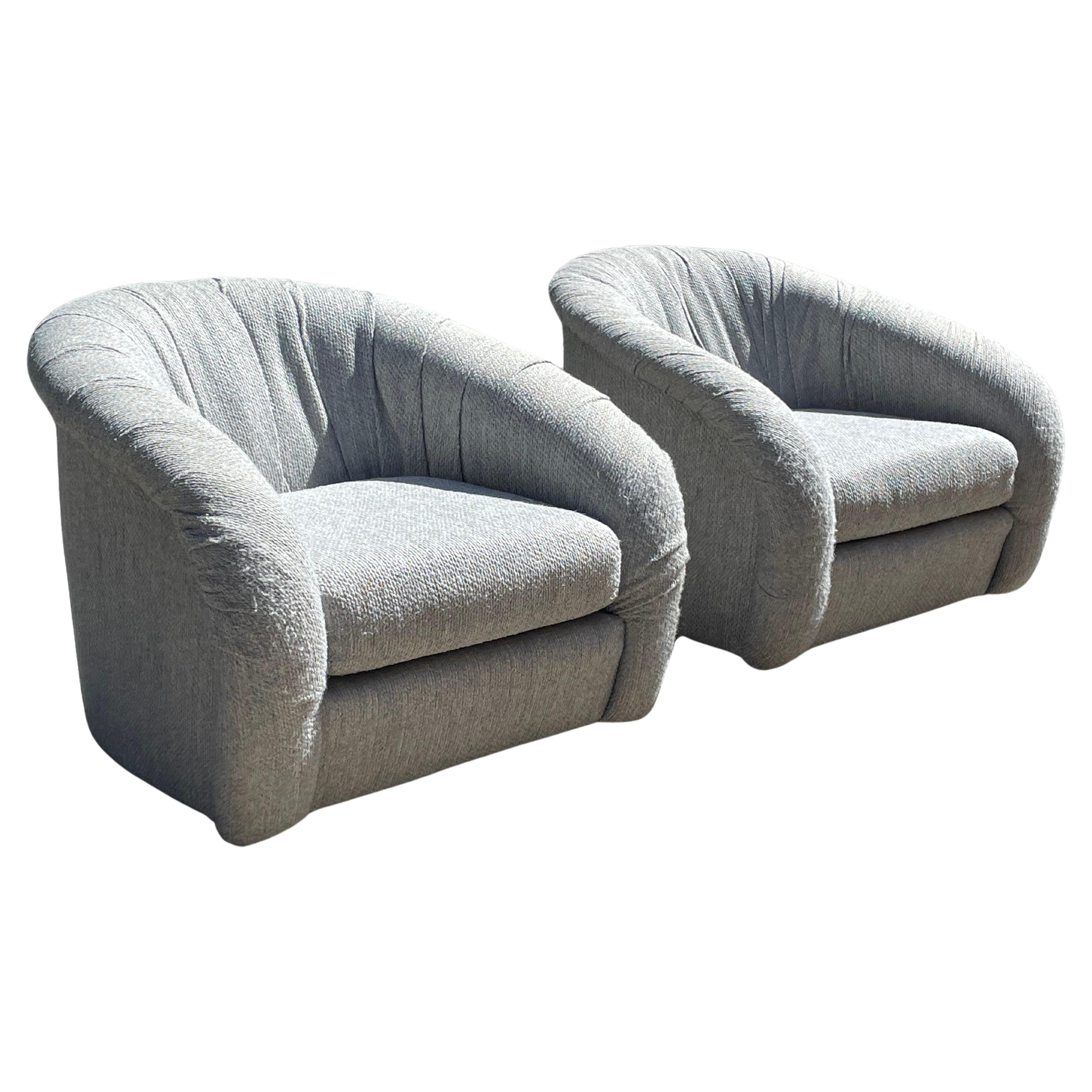 A stunning pair of Milo Baughman barrel swivel chairs. In original, blue grey fabric. Very good vintage condition.

Ruched 360° seat backs with super comfortable cushions. And they swivel. 

Dimensions -
34”w x 33”D x 28”H
Seat Height - 16”H

Price