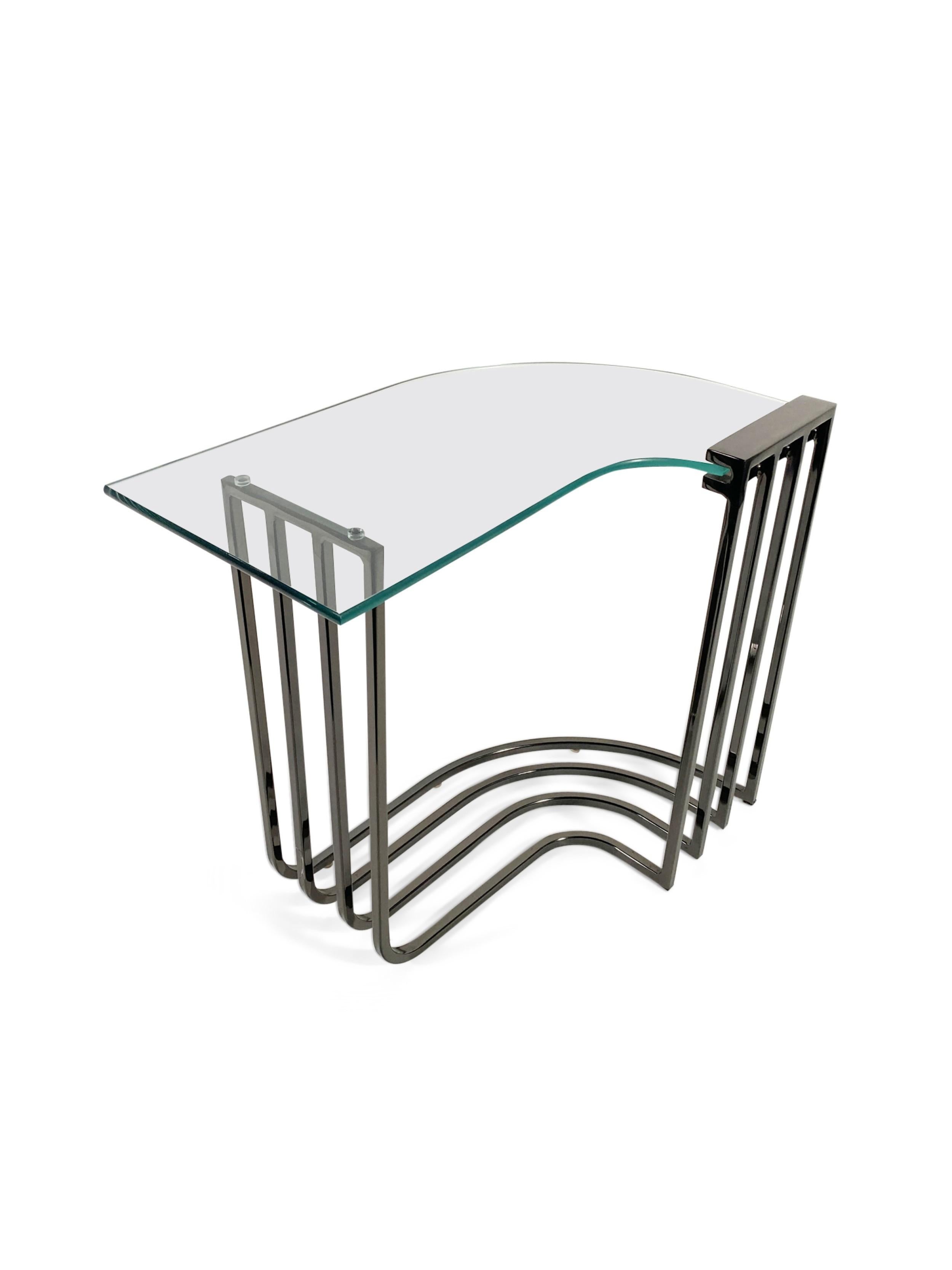 American Mid-Century side table comprised of 4 bronzed chrome bars that curves into a right angle and having a slot to hold a glass top (MILO BAUGHMAN)