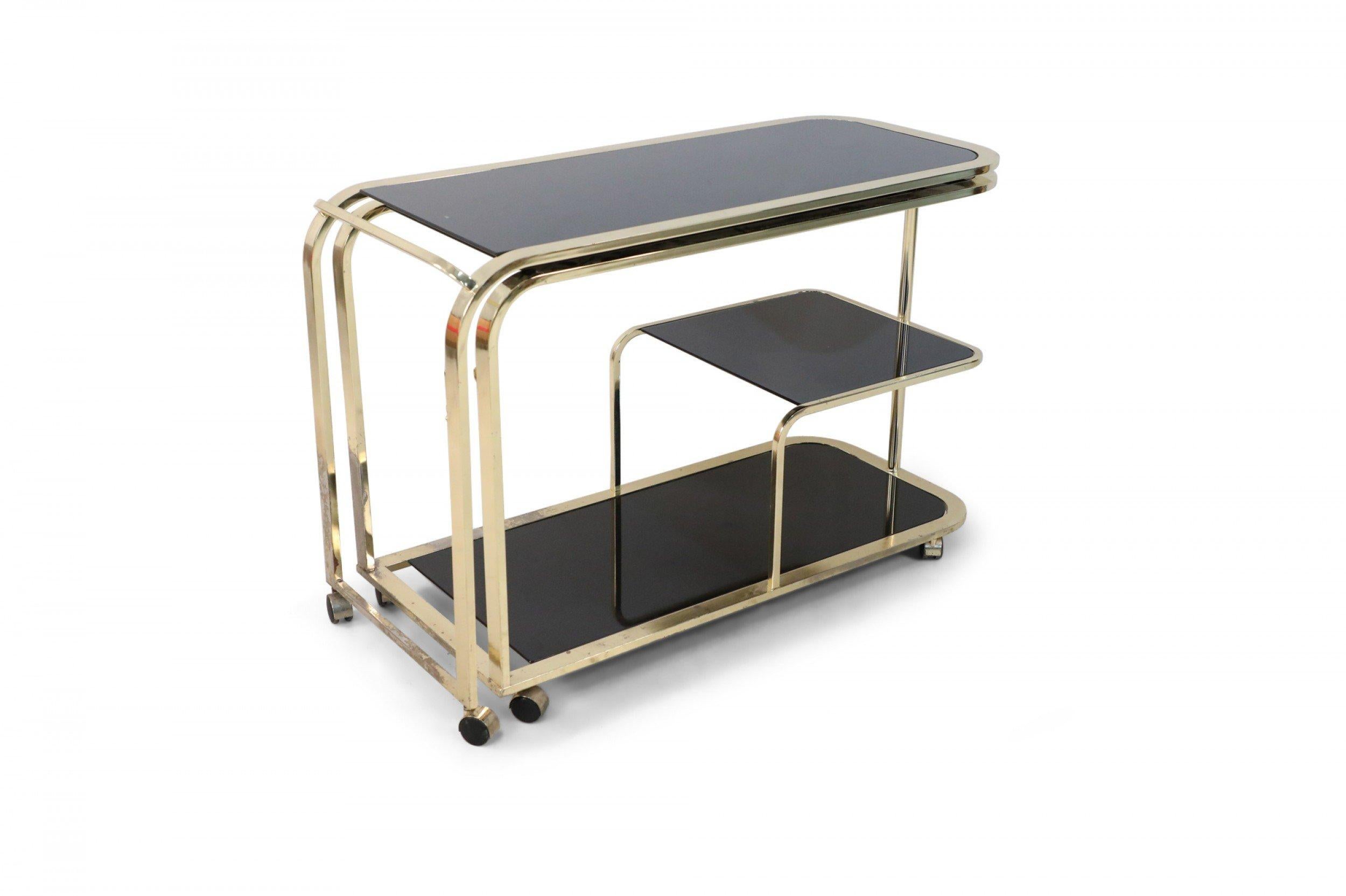 Design Institute of America Mid-Century Gilt Metal and Black Glass Bar Cart In Good Condition For Sale In New York, NY