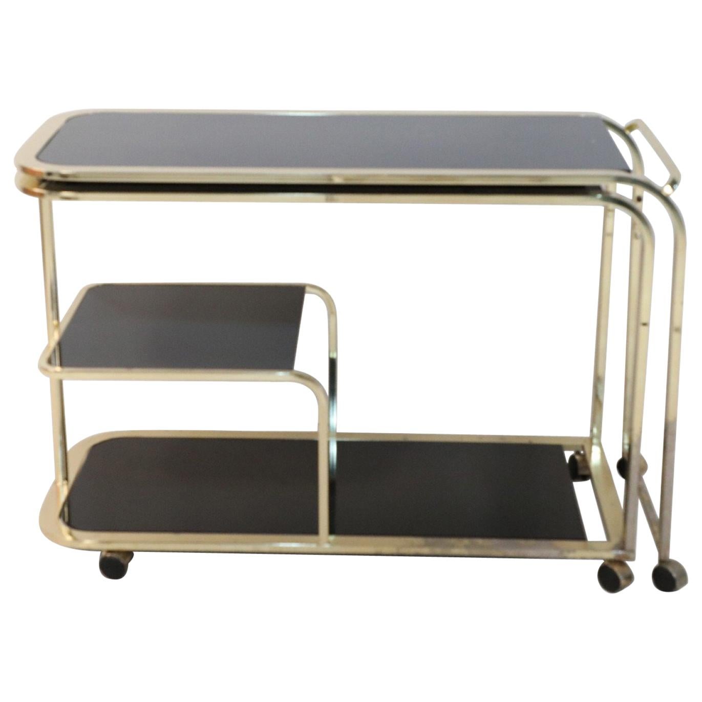 Design Institute of America Mid-Century Gilt Metal and Black Glass Bar Cart For Sale