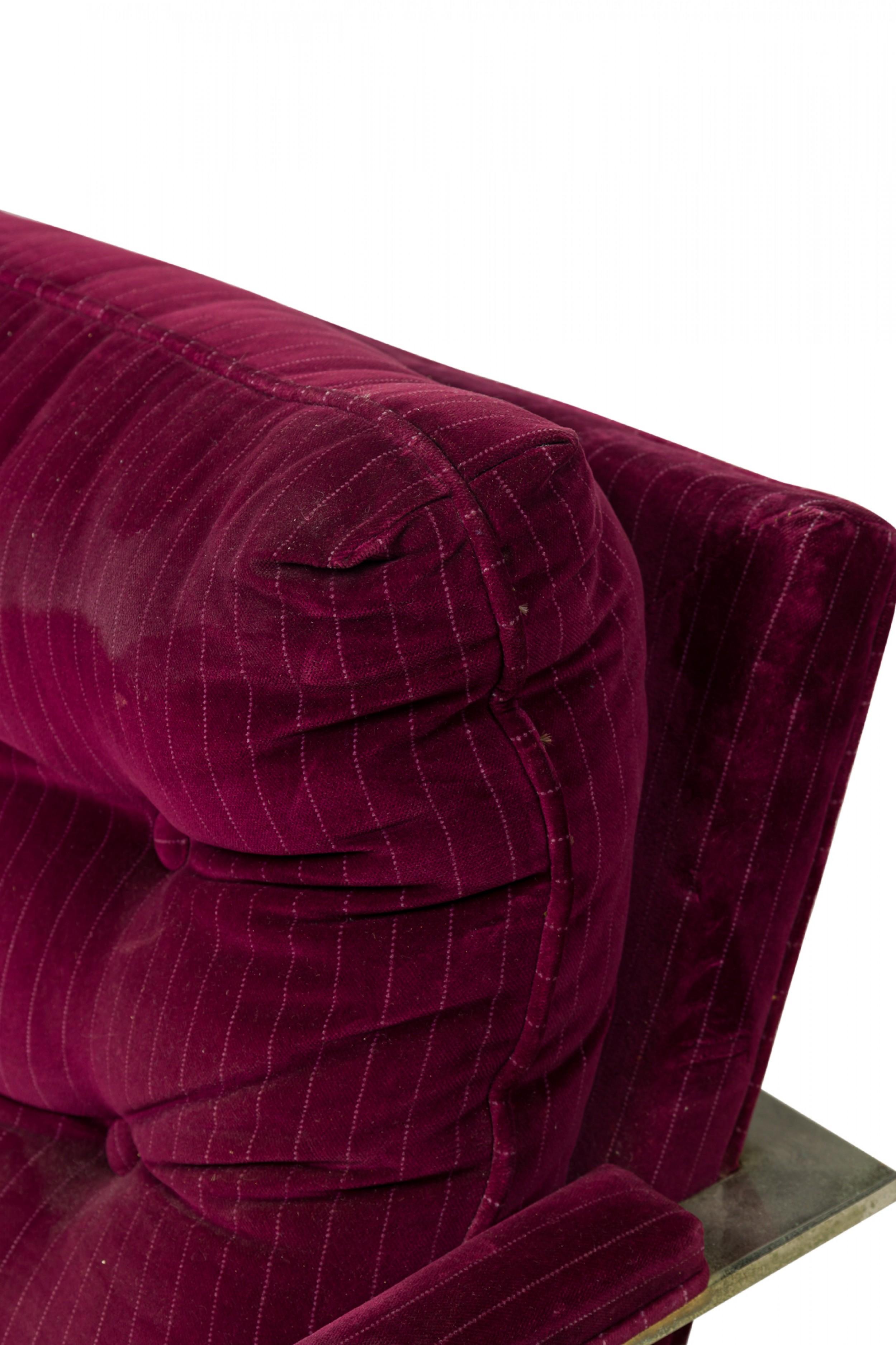American Mid-Century lounge armchair with a polished chrome flat bar frame, upholstered in a pinstriped raspberry purple velour fabric. (MILO BAUGHMAN)(Similar chair in beige / taupe upholstery: REG5102A)
 

 Wear to upholstery, tarnishing to frame.
