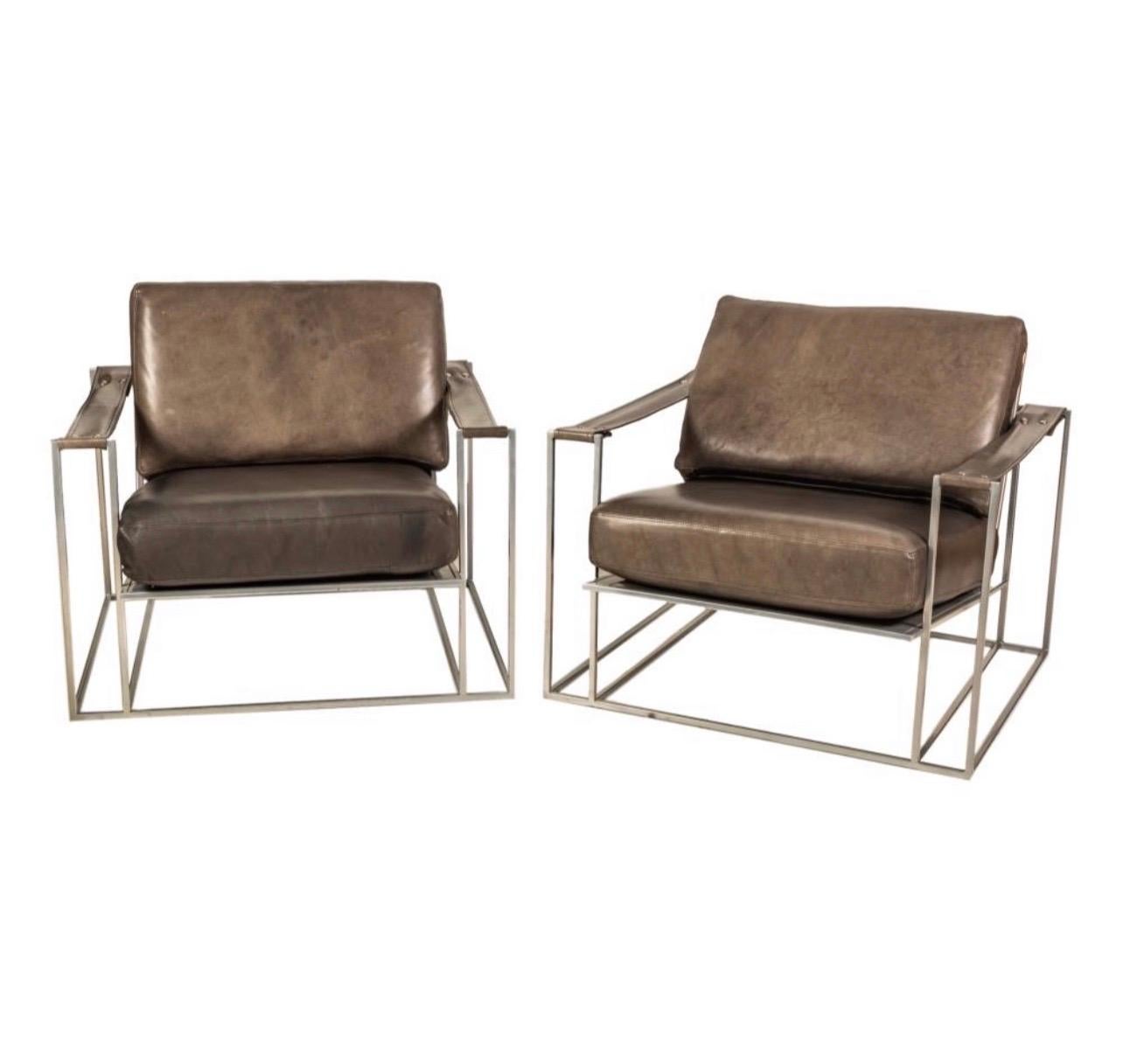 A Pair of Milo Baughman arm chairs manufactured for Thayer Coggin. 
They retain the original faux leather upholstery in dark grey/brownish tones.
Designed by Milo Baughman in 1972.