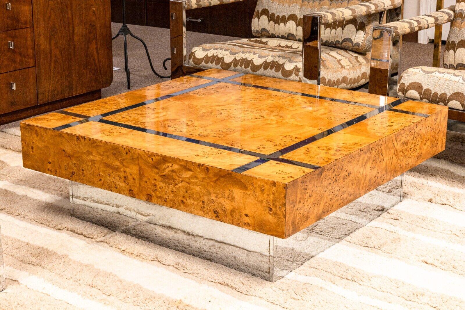 Strikingly sophisticated, this Milo Baughman Attributed burl wood and chrome floating coffee table exemplifies mid-century modern elegance. The table features a luxurious burl wood veneer with rich, swirling patterns that give it a distinctive,