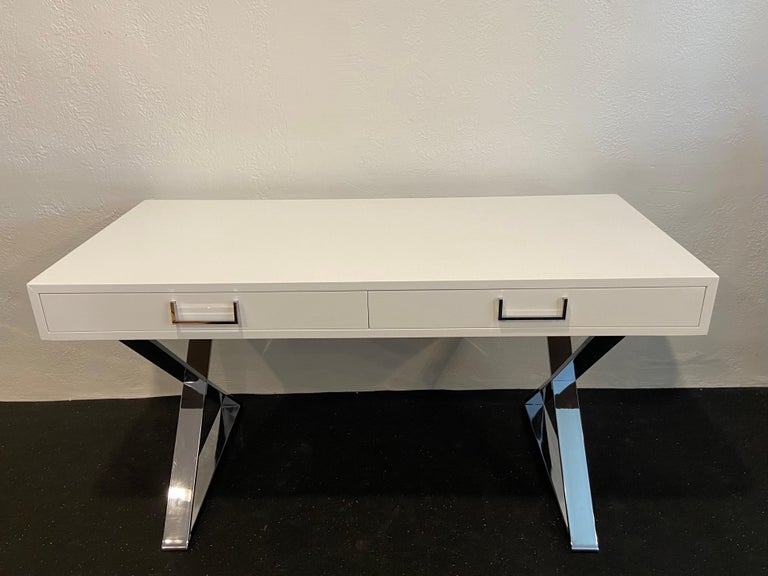Milo Baughman attributed lacquered desk. Desk has been re-lacquered in the original white finish and polished. 

Would work well in a variety of interiors such as modern, mid century modern, Hollywood regency, etc. Piece blends seamlessly with