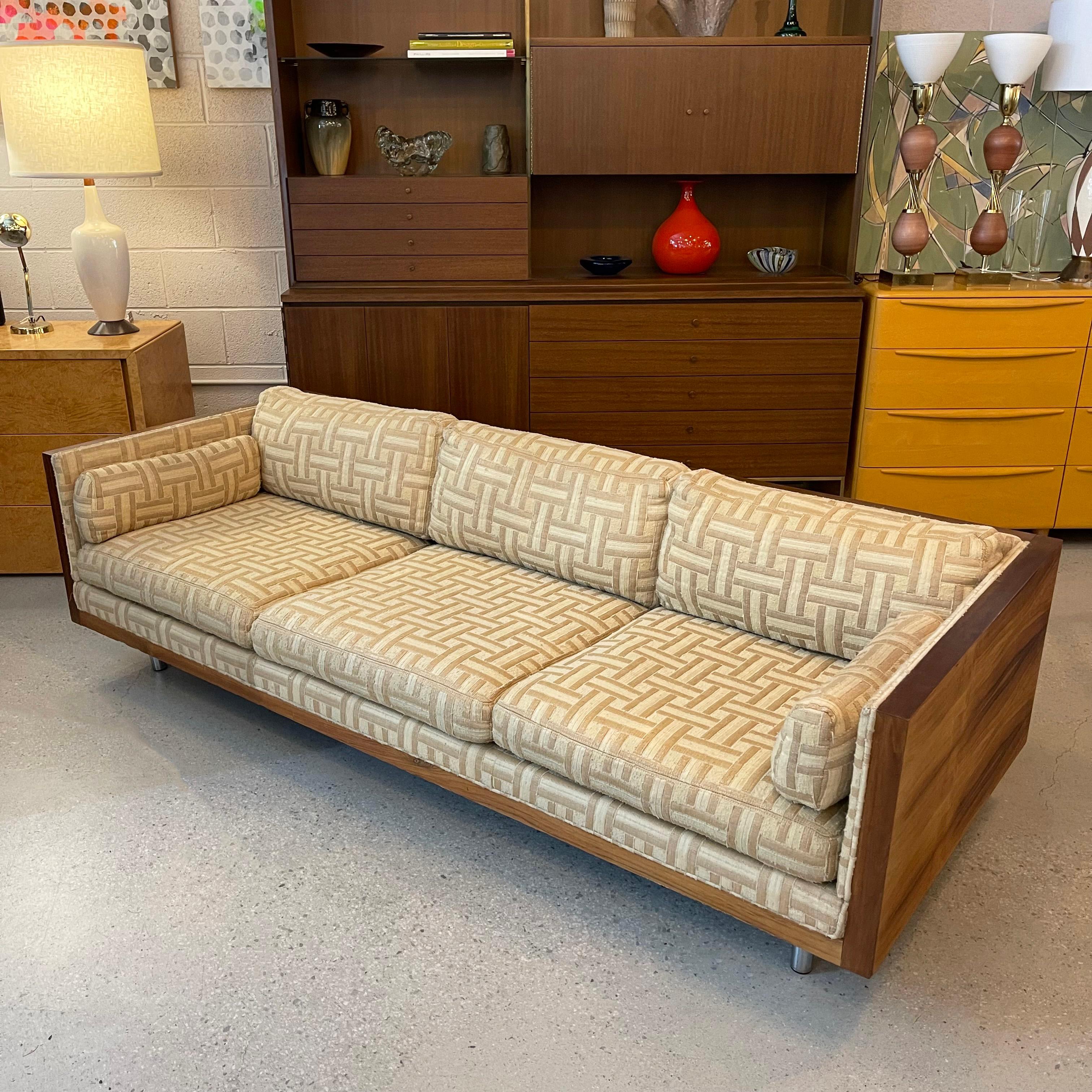 Sleek, low-profile, mid-century modern, rosewood case sofa by Milo Baughman for Thayer Coggin features a beautifully grained rosewood surround with tubular chrome legs and nubby, raw linen upholstery with neutral lattice pattern that is soft to the