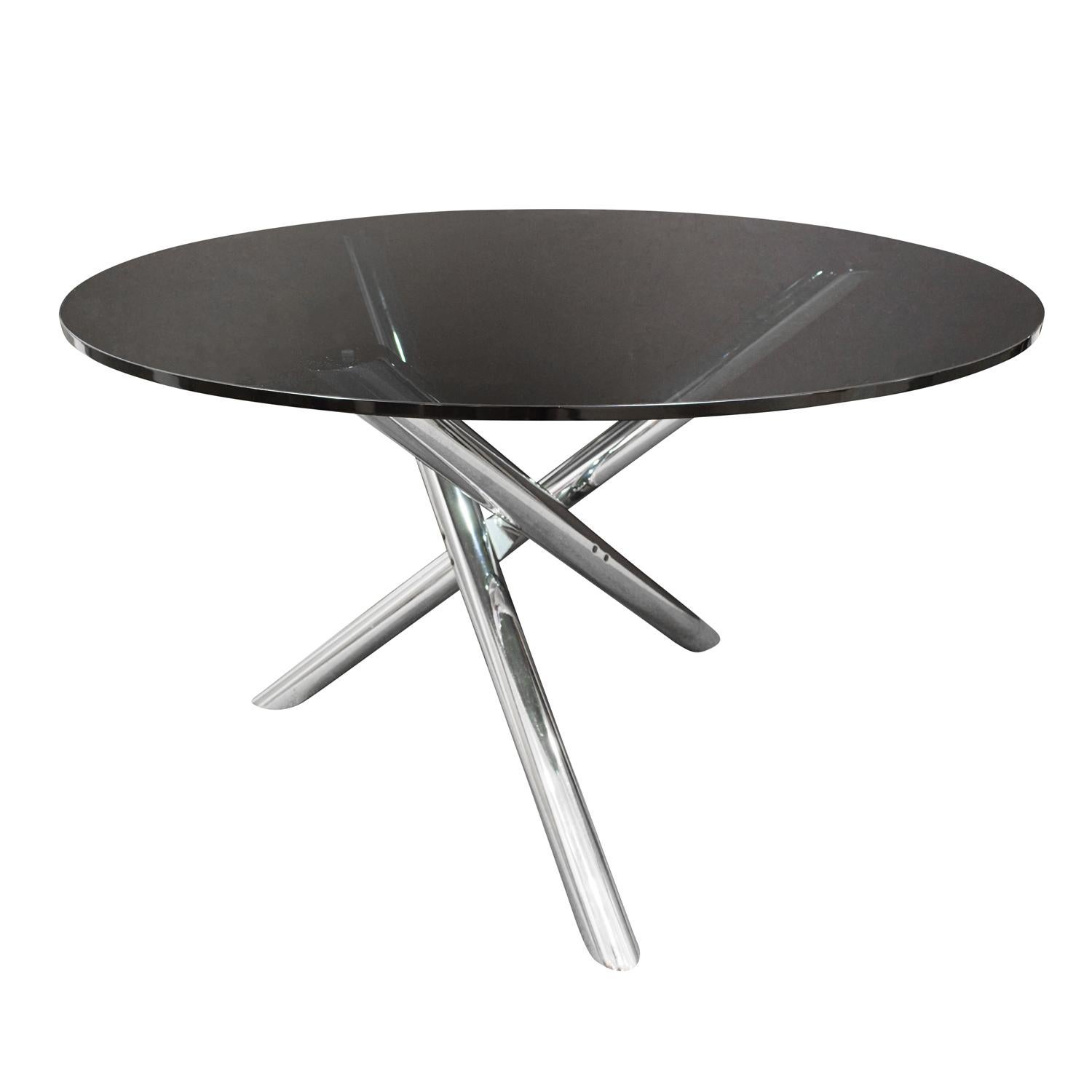Sculptural dining/game table with base in polished chrome with smoked glass top attributed to Milo Baughman, American 1970s.