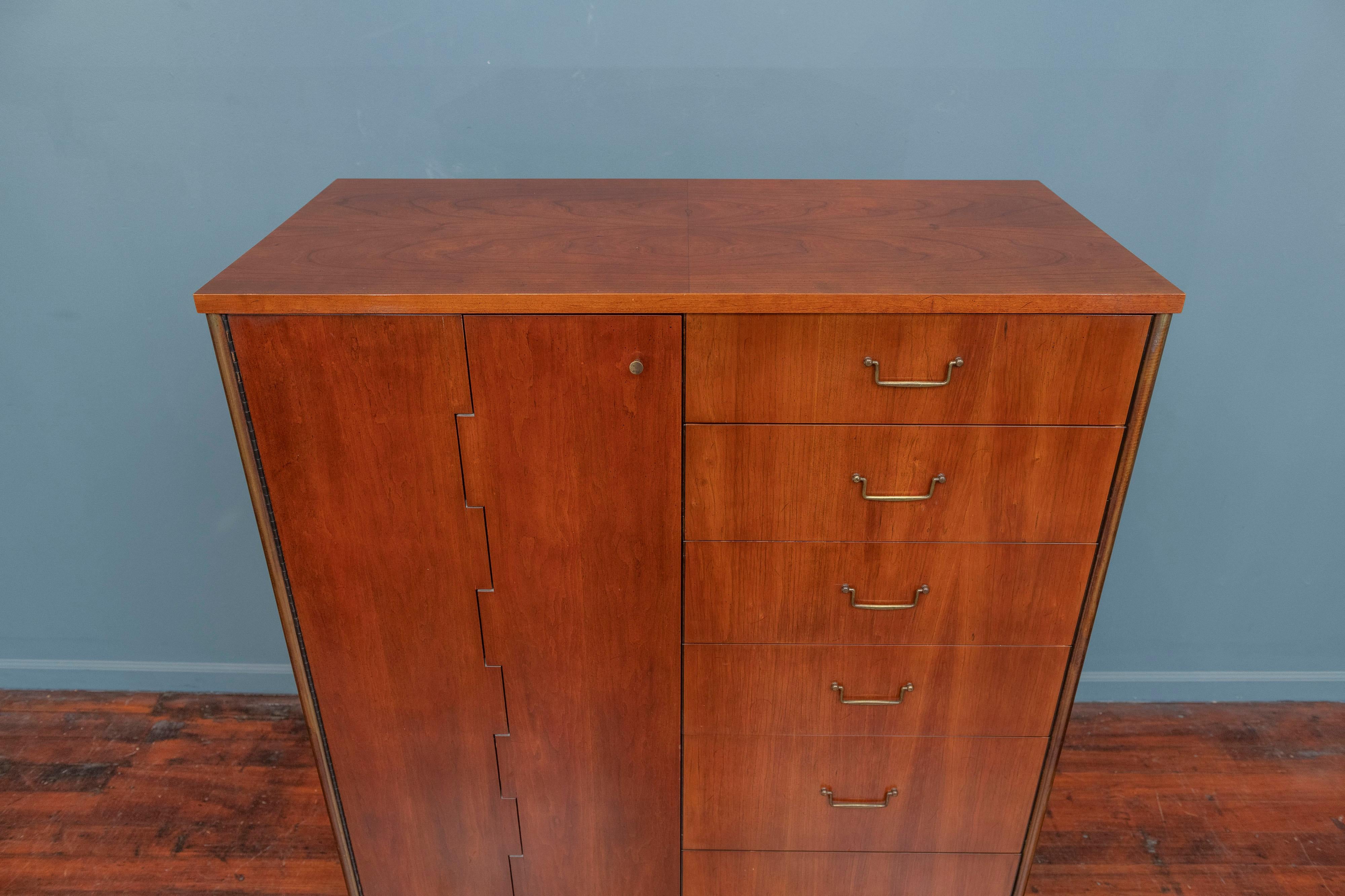 Milo Baughman cabinet from his Directional line for Calvin furniture company. Handsome and multi functional form chest or storage cabinet, made from cherry and oak with patinated brass hardware and frame.
Featuring six drawers in graduating depths