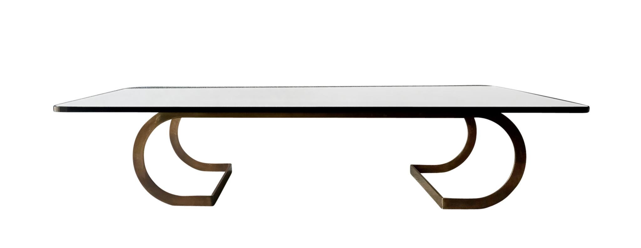 A superb minimalist profile coffee or cocktail table by the legendary American Designer, Milo Baughman. The hefty bronzed-steel base and 3/4