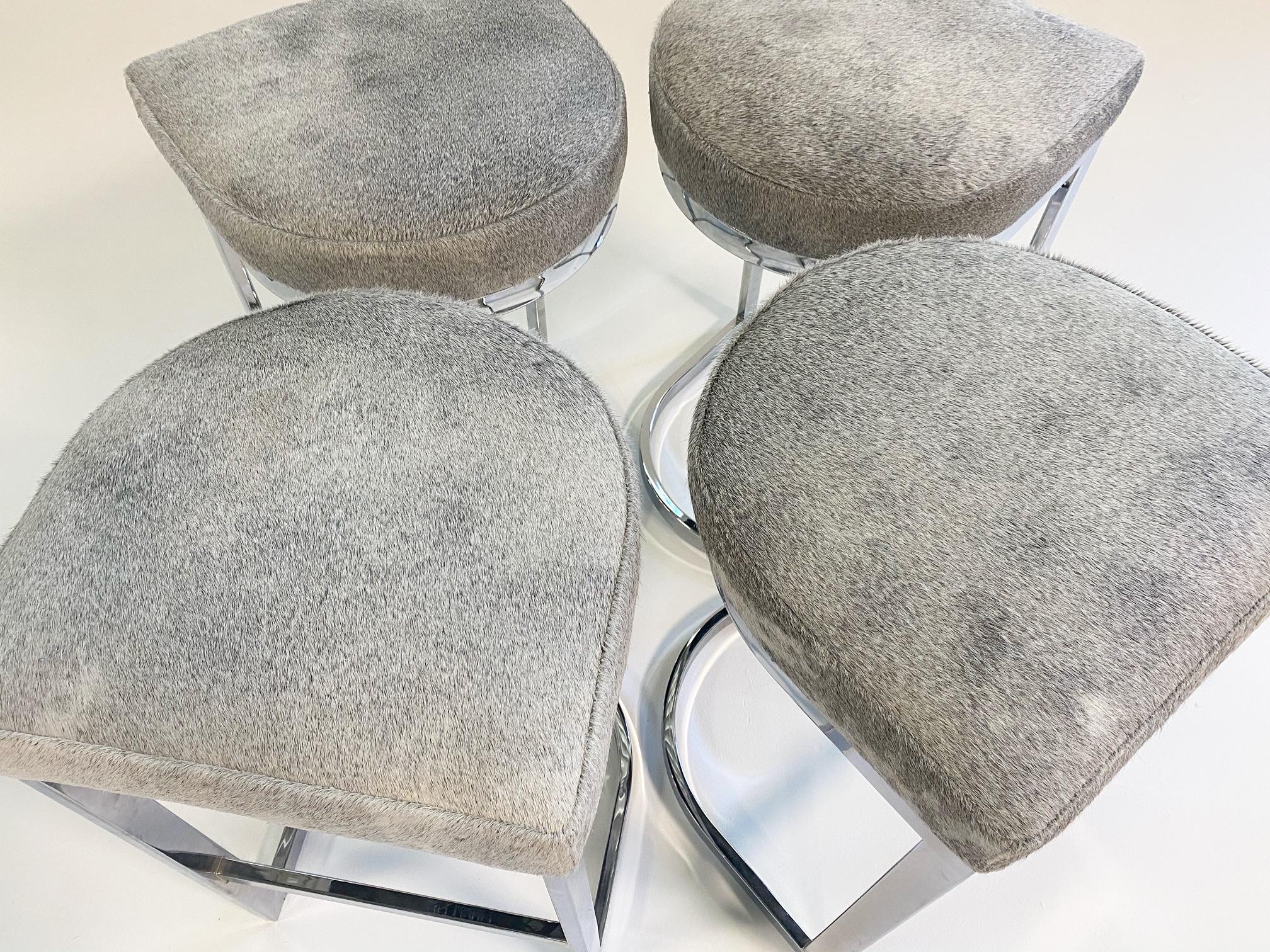 In a room, the eye is always drawn to metal. The sheen, the shine, the reflections. What better way to add a bit of metal to a room than with a set of these chrome-plated steel bar stools. Each chair underwent our signature restoration. Our master