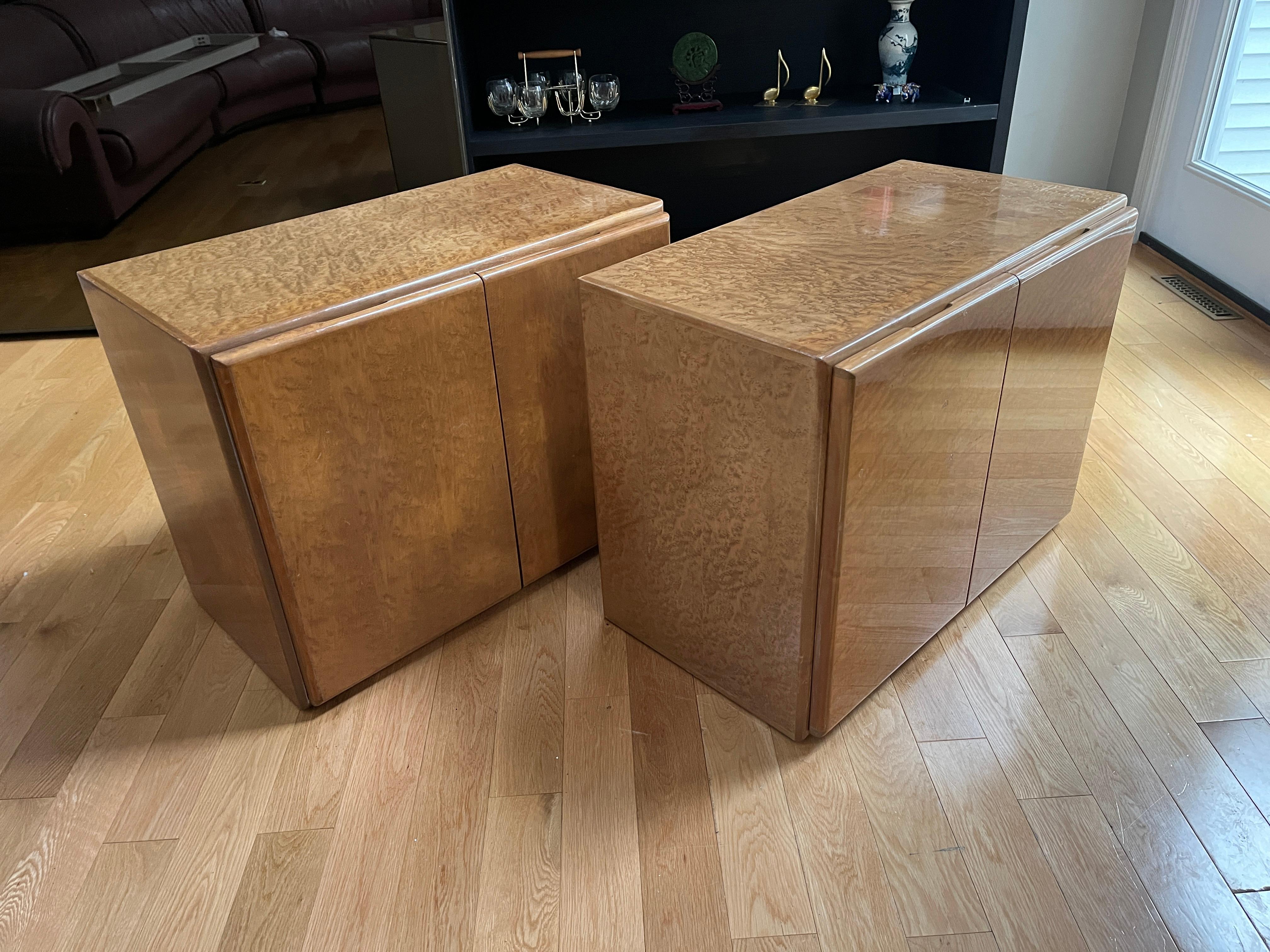 A gorgeous pair of Mid-Century Modern birdseye maple nightstands by Milo Baughman for Thayer Coggin. May be placed on gold plinth base should you wish to use as a credenza.