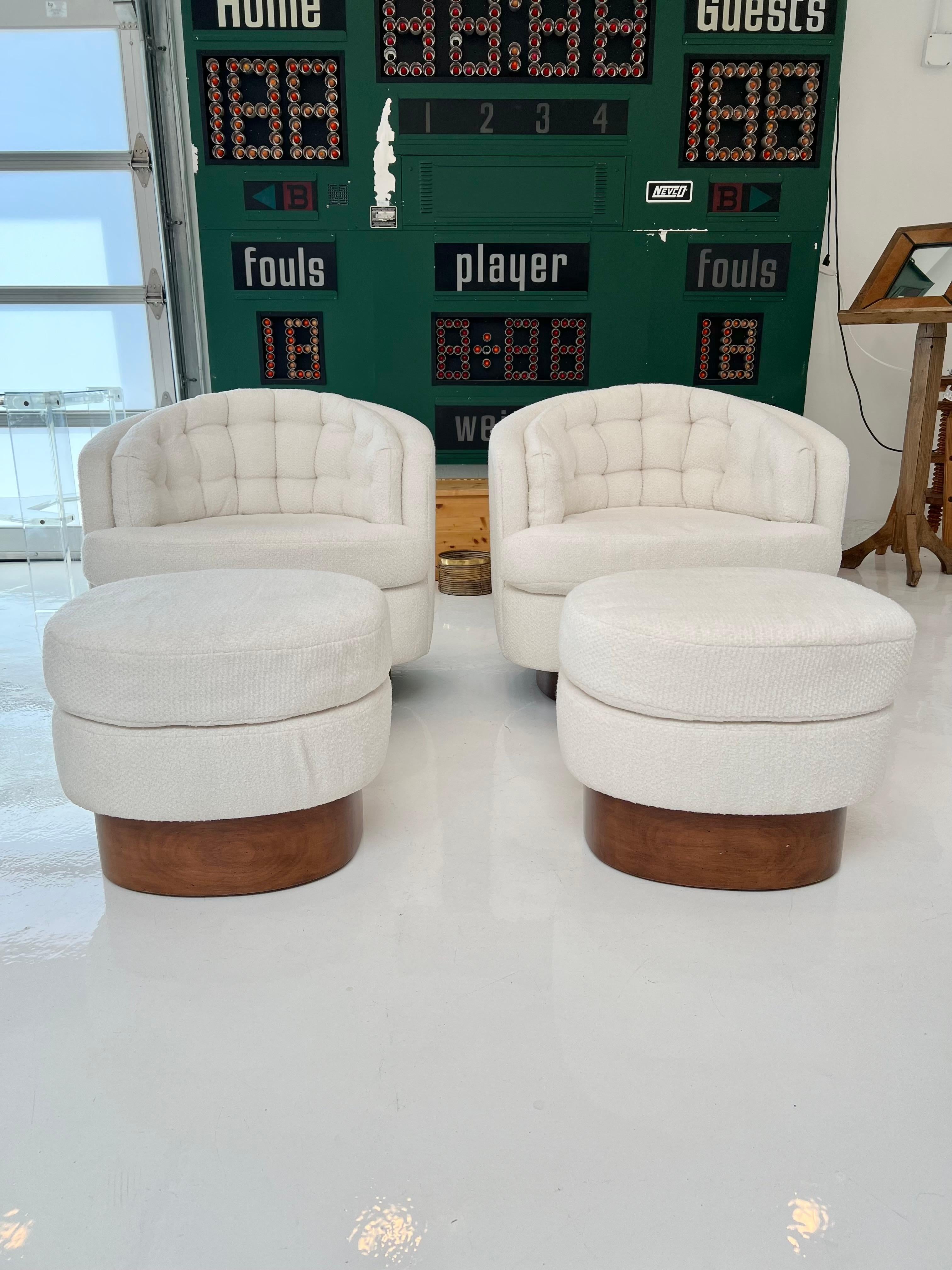 Stunning pair of Milo Baughman club chairs with matching ottomans. Wood plinth bases to all 4 pieces. Tufted back cushion on chairs adds a ton of comfort and style. Chairs rock back and forth and swivel. Great condition to boucle fabric. Sold as a
