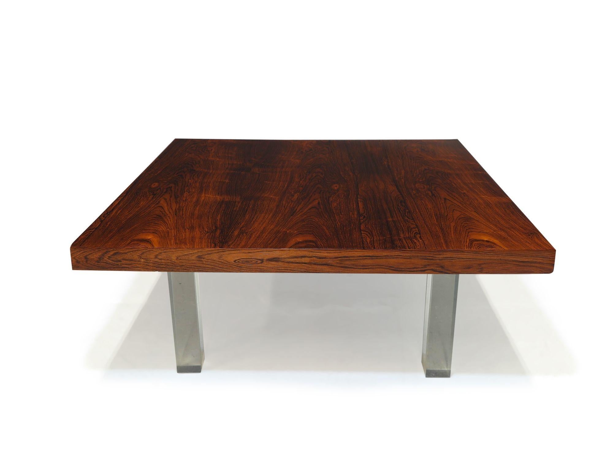 Midcentury rosewood coffee table designed by Milo Baughman for Thayer Coggin, circa 1968 United States.
The coffee table is crafted of rosewood with book-matched grain, raised on lucite legs. Restored in a natural oil finish. 
Measurements 
W