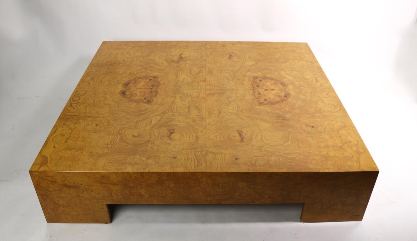 Extraordinary extra large square coffee table designed by Milo Baughman. Executed in all over burl, very fine, original, clean and ready to use condition.
