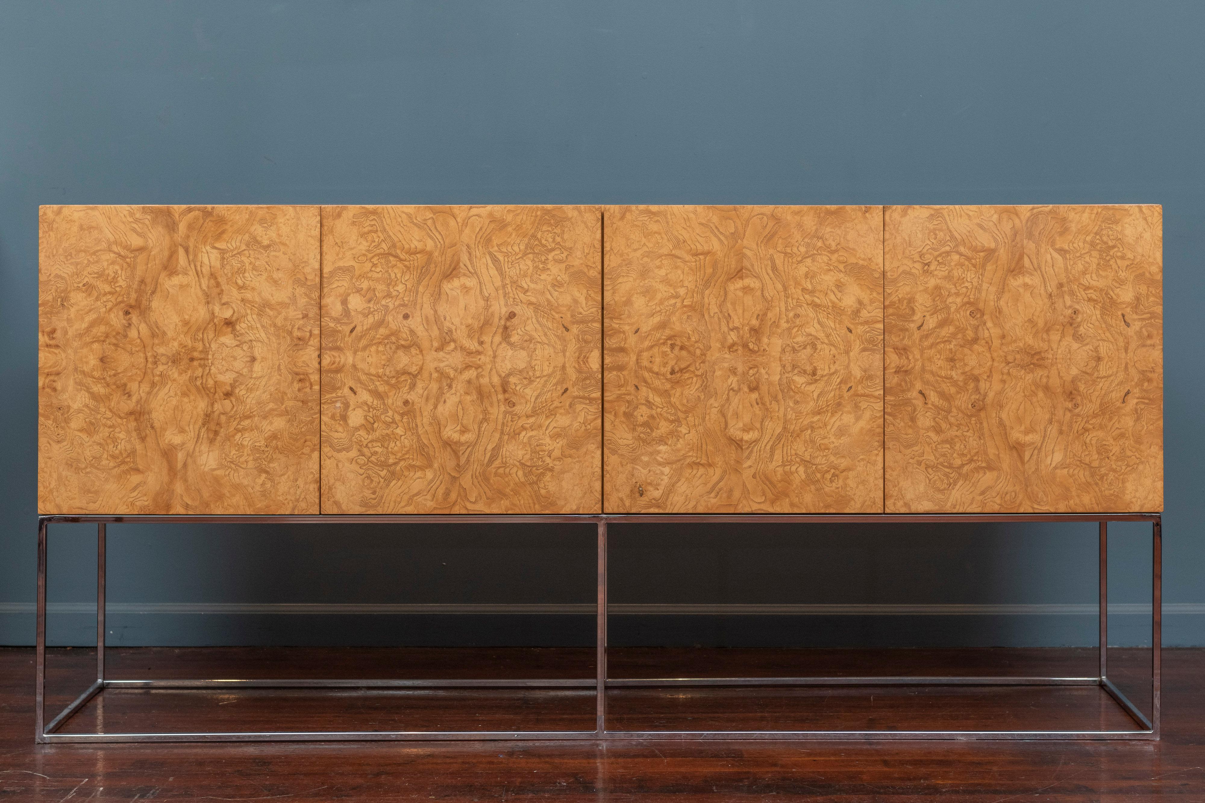 Milo Baughman design burl olive wood credenza or cabinet for Thayer Coggin, U.S.A. Beautiful burl wood figuring throughout the exterior and interior of the cabinet with an adjustable glass shelf and two drawers for accessories, labeled.
