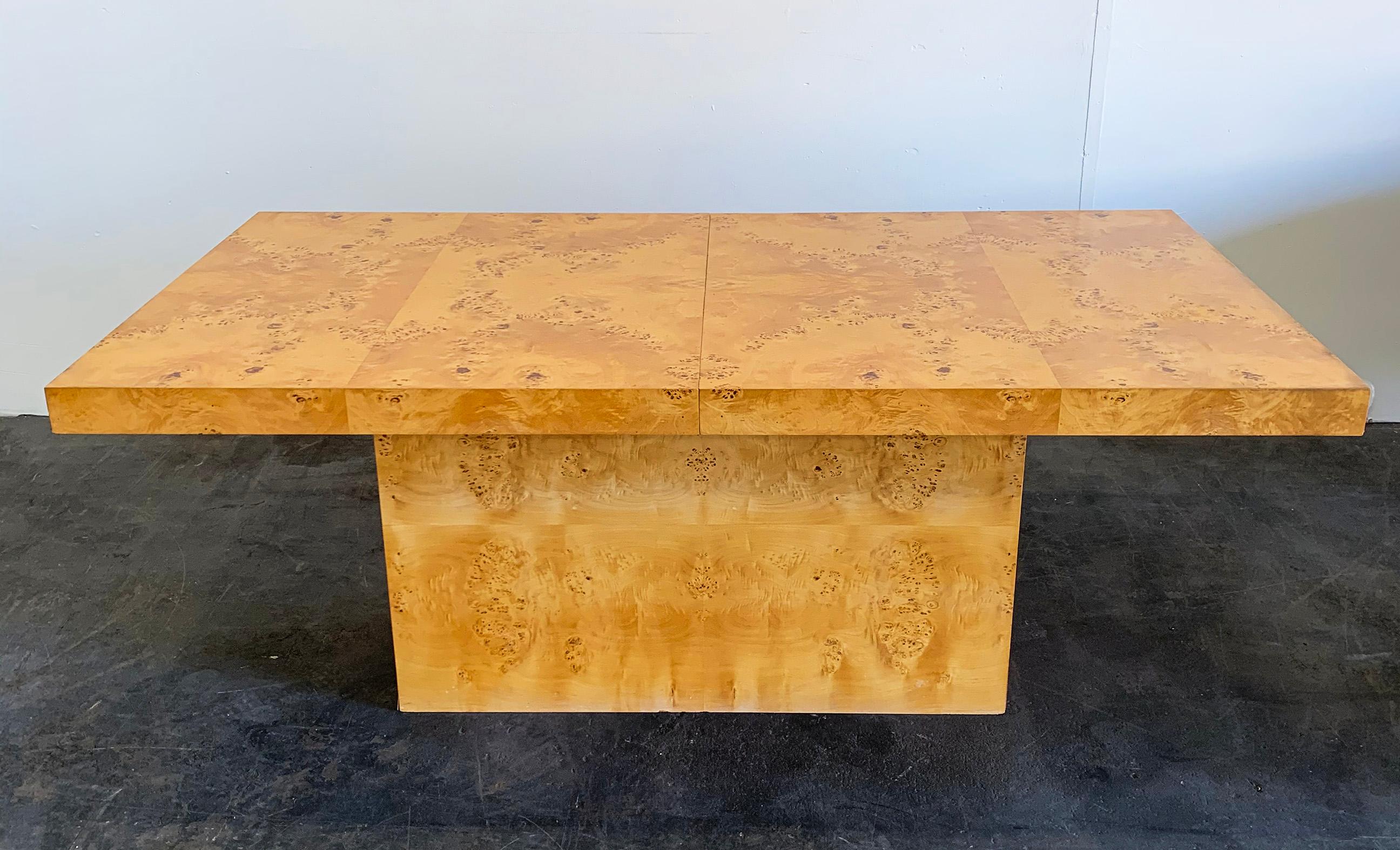 A stunning and timeless example of design, this Milo Baughman burl wood dining table is a true Classic. The dining table features a great burl pattern and is in good vintage condition with a warm honey patina throughout.

The leaves of the table