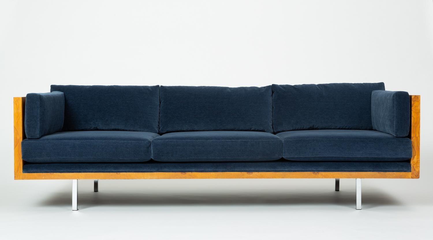 A sumptuous restoration of Milo Baughman's Classic 2165 Sofa for Thayer Coggin. Designed in 1968, the sofa has a three-sided case in highly figured olive burl, and the long, horizontal design appears to float above the ground on four chrome-plated