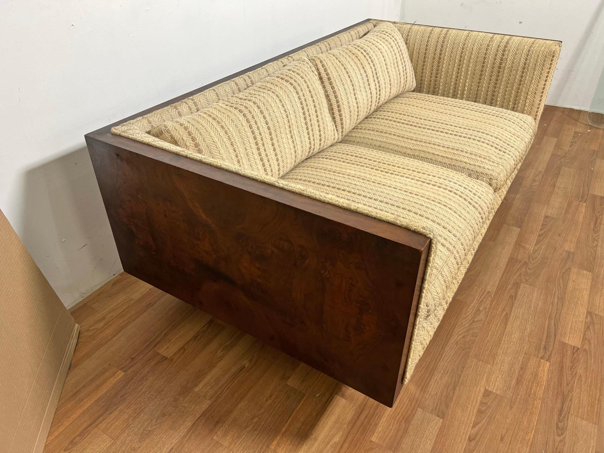 Loveseat by Milo Baughman for Thayer Coggin, featuring a burlwood case and chrome base, circa 1960s.