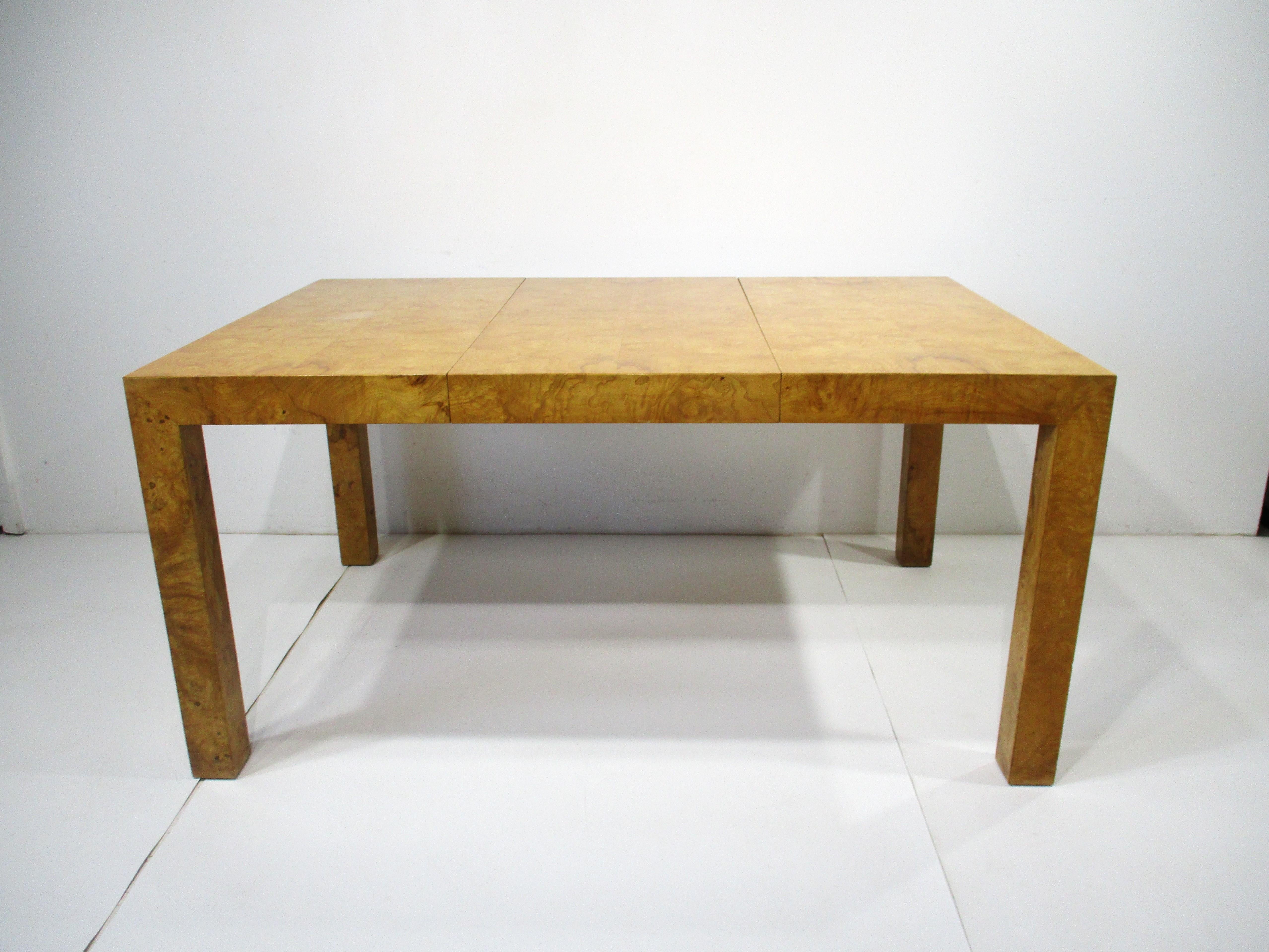 A wonderfully striking parson styled dining table in Olive burlwood with two 19.5