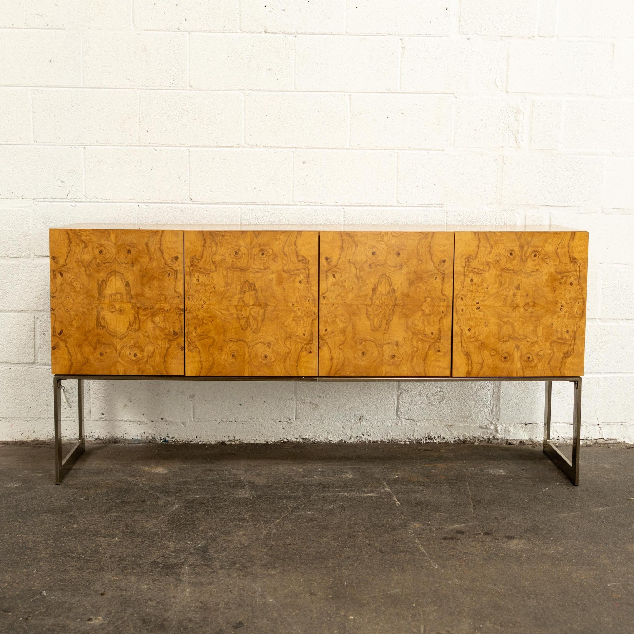 c. 1970s in excellent vintage condition ft. modular storage, chrome sled legs, and removable orange velvet drawer liners. This piece is iconic for a reason.