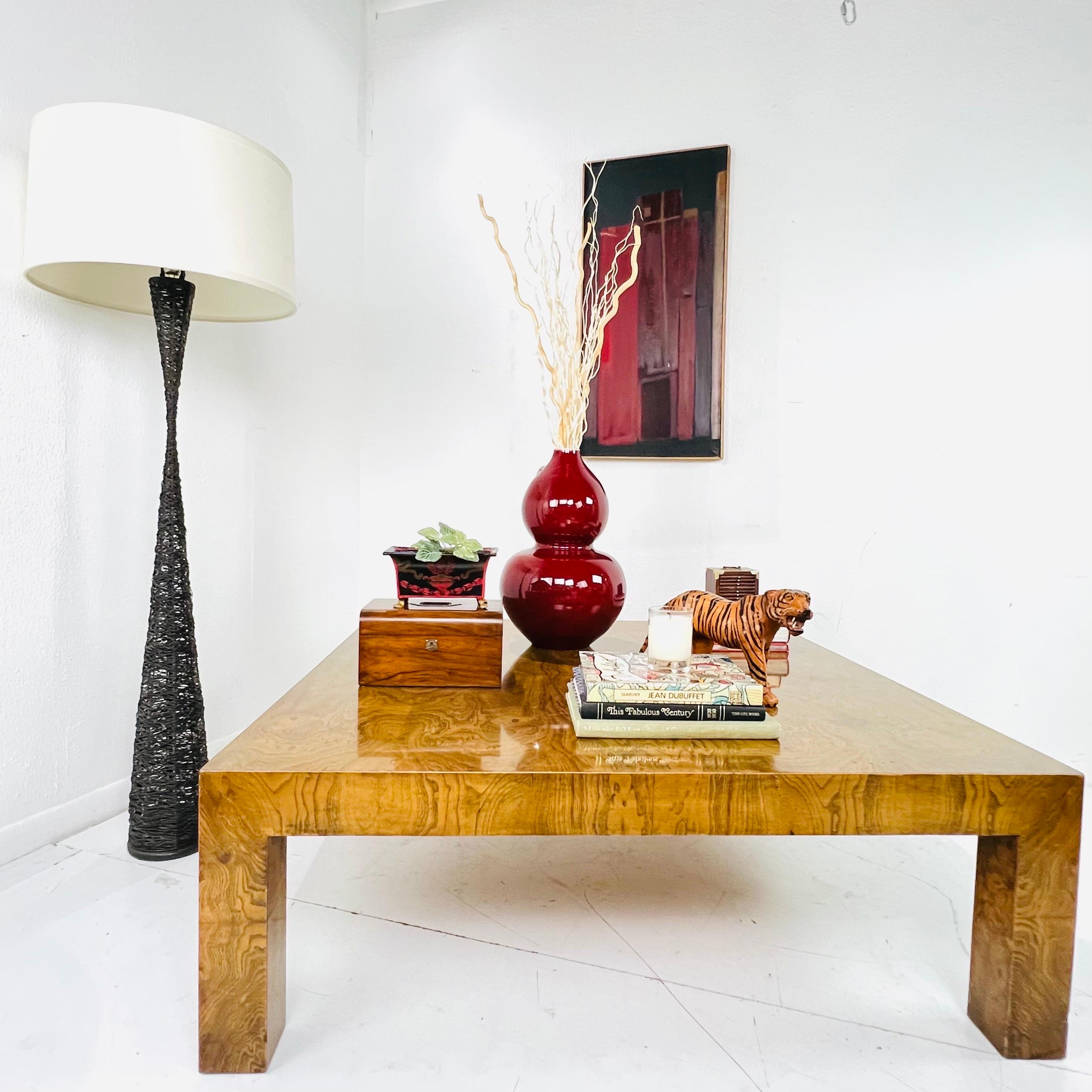 Large scale 1970s burlwood coffee table designed by Milo Baughman. Great proportions and a very timeless design. Great details like the thick and rich veneer. Table is sturdy and in good vintage condition with some minor cosmetic imperfections