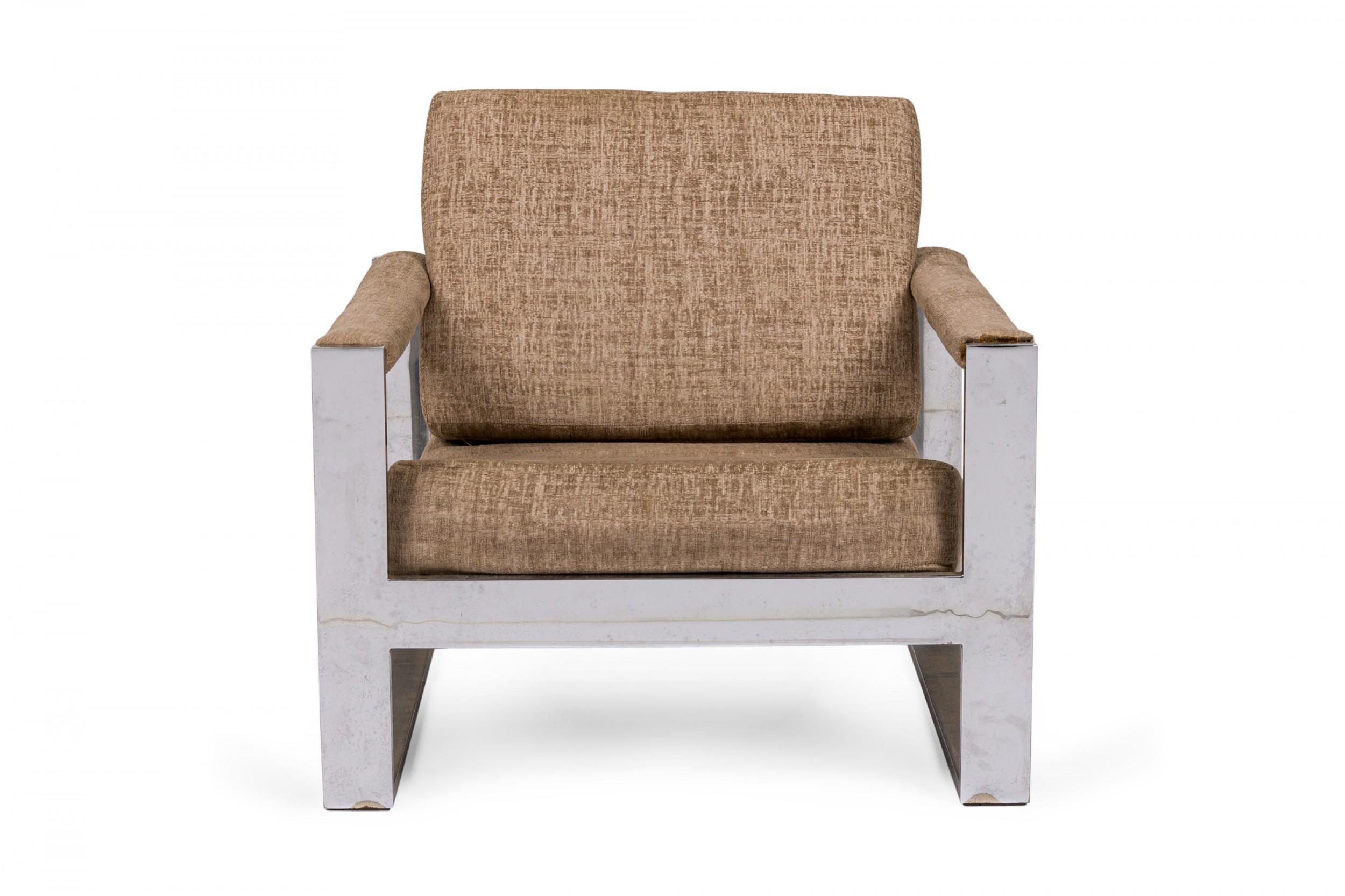 American Mid-Century 'Tank' form lounge / armchair with a flat bar polished chrome frame and textured light brown upholstered seat, back and arm covers. (MILO BAUGHMAN).
 