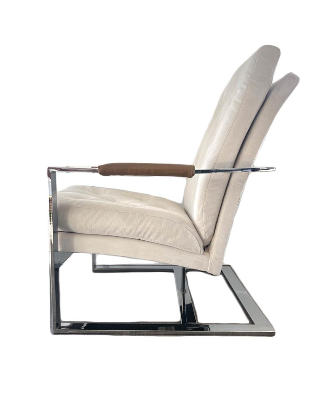 Stunning Mid-Century Modern chrome cantilever chair by Milo Baughman. The velvet upholstery is new and the arm rests have been covered in leather for added uniqueness. The chrome of the chair wraps around the back, making this piece beautiful from