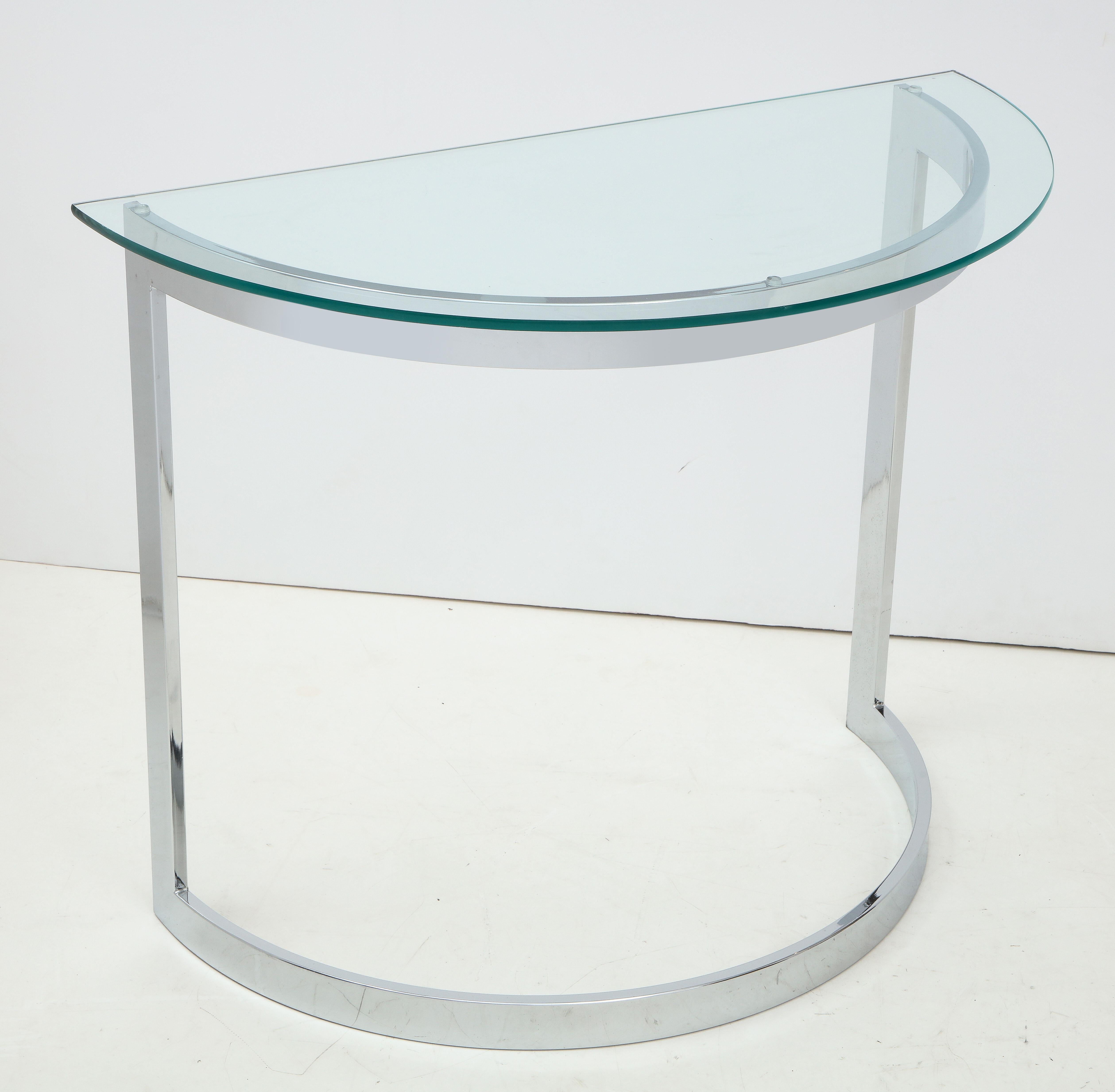 Chrome and glass demilune console table.
The glass top is 1/2