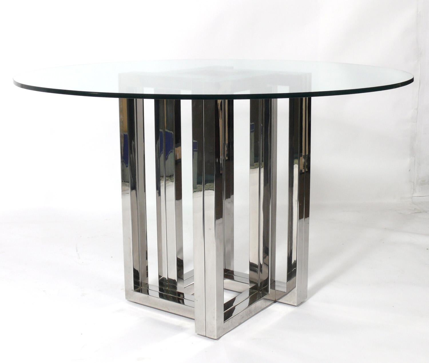 Mid-Century Modern chrome dining table, designed in the style of Milo Baughman, unsigned, American, circa 1960s. Please see our otherdining chairs from the same estate seen in the last photo. This listing is for the dining table only. The original