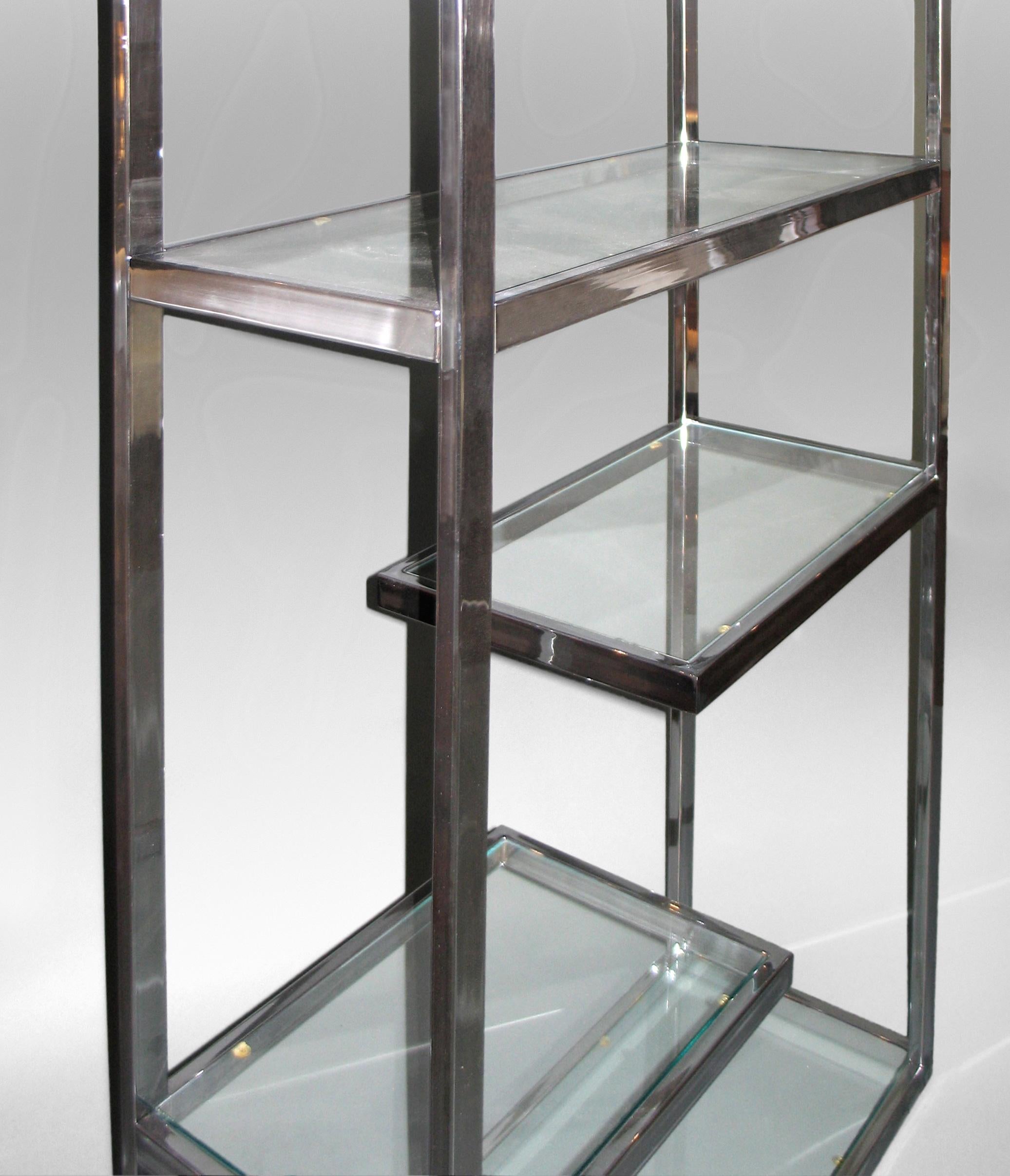 Milo Baughman, Chrome Etagere with Glass Shelves
Circa 1970
The best of everything, superior style and condition; a marvelous way to display a collection. The polished chrome geometric frame supporting two full and four floating cantilevered