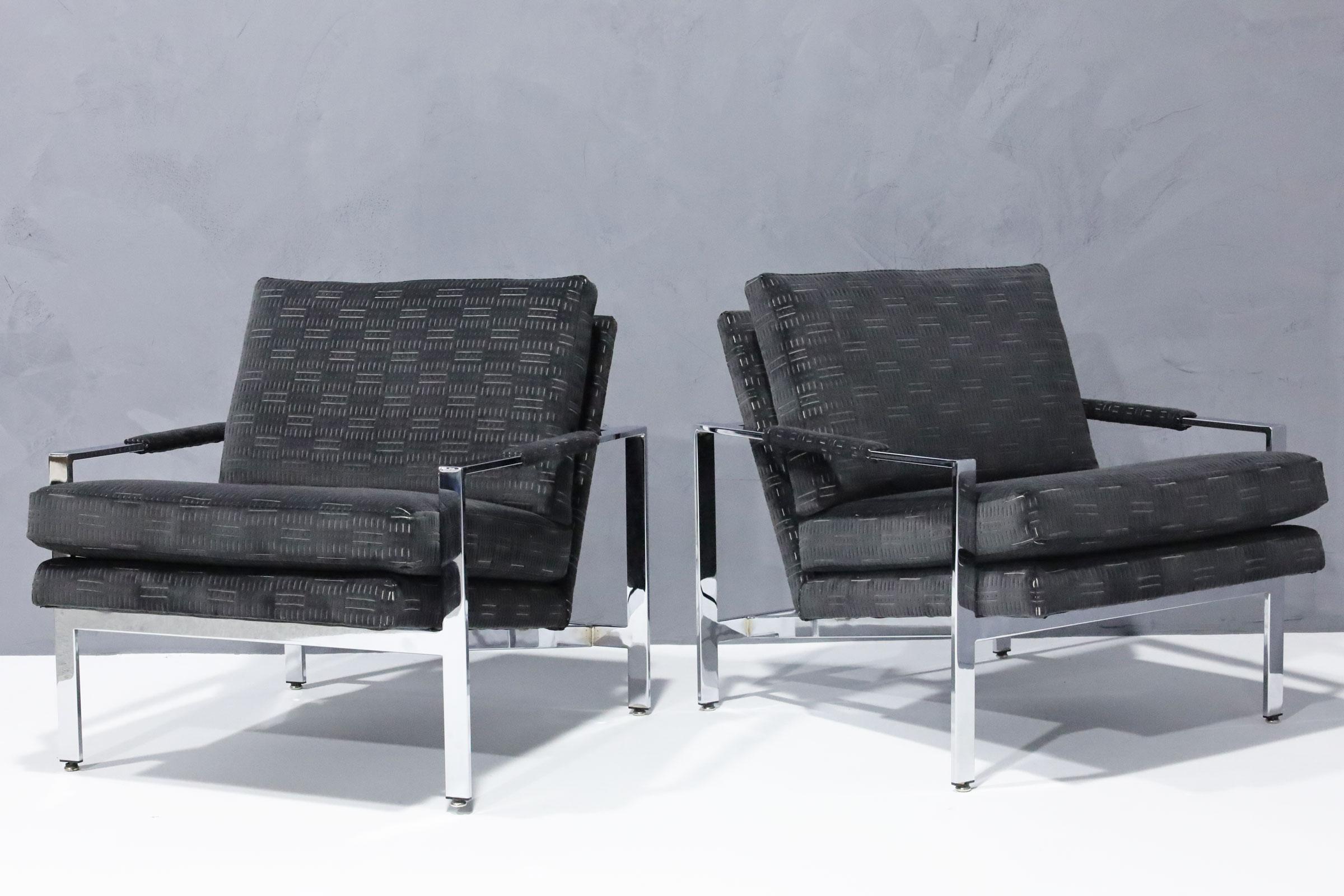 One of his timeless designs, a pair of chrome frame lounge chairs in new cut velvet upholstery.