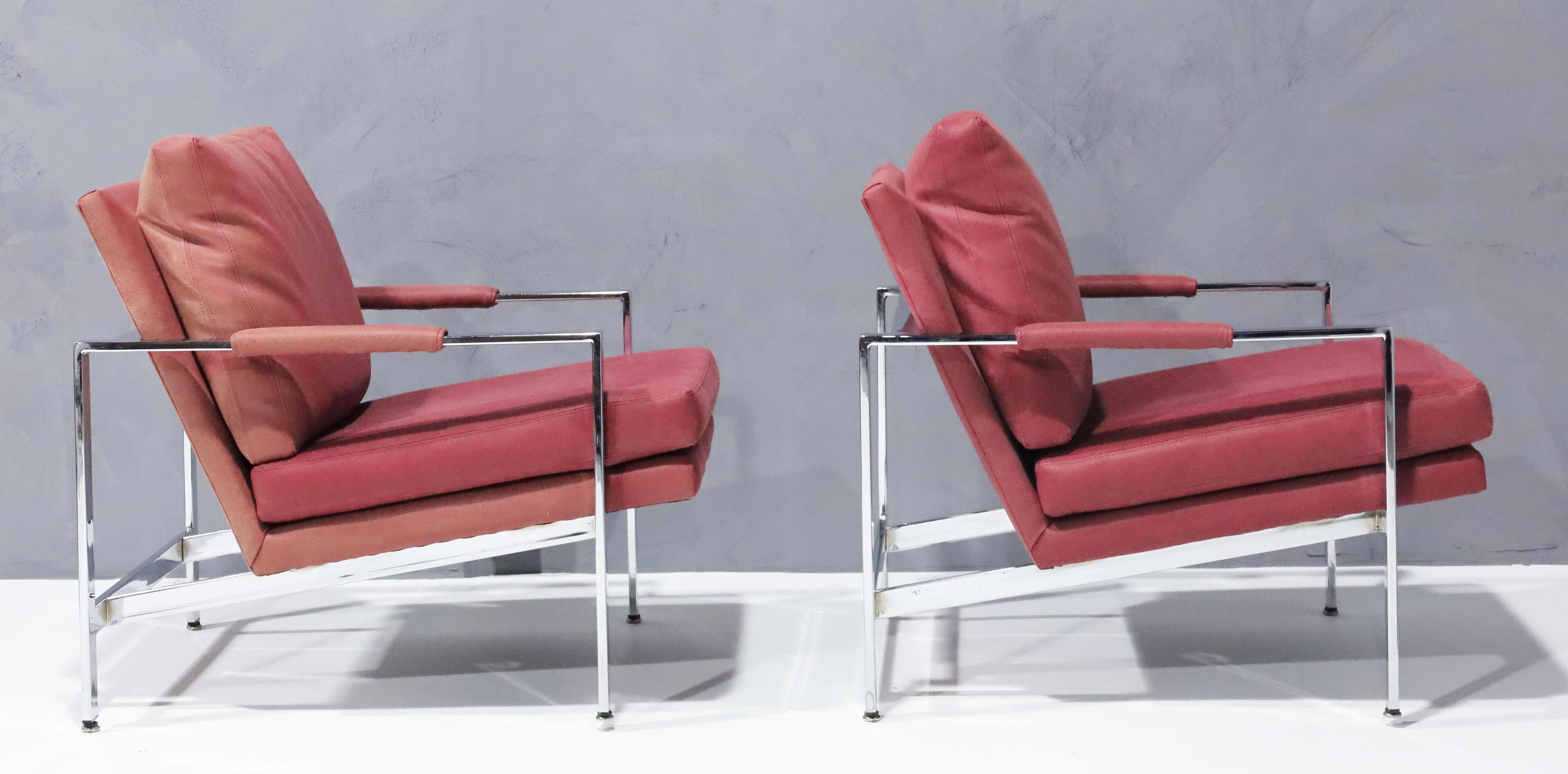 One of his timeless designs, a pair of chrome frame lounge chairs in a dusty rose faux suede/leather. The colors are slightly uneven in the back due to sun fading.