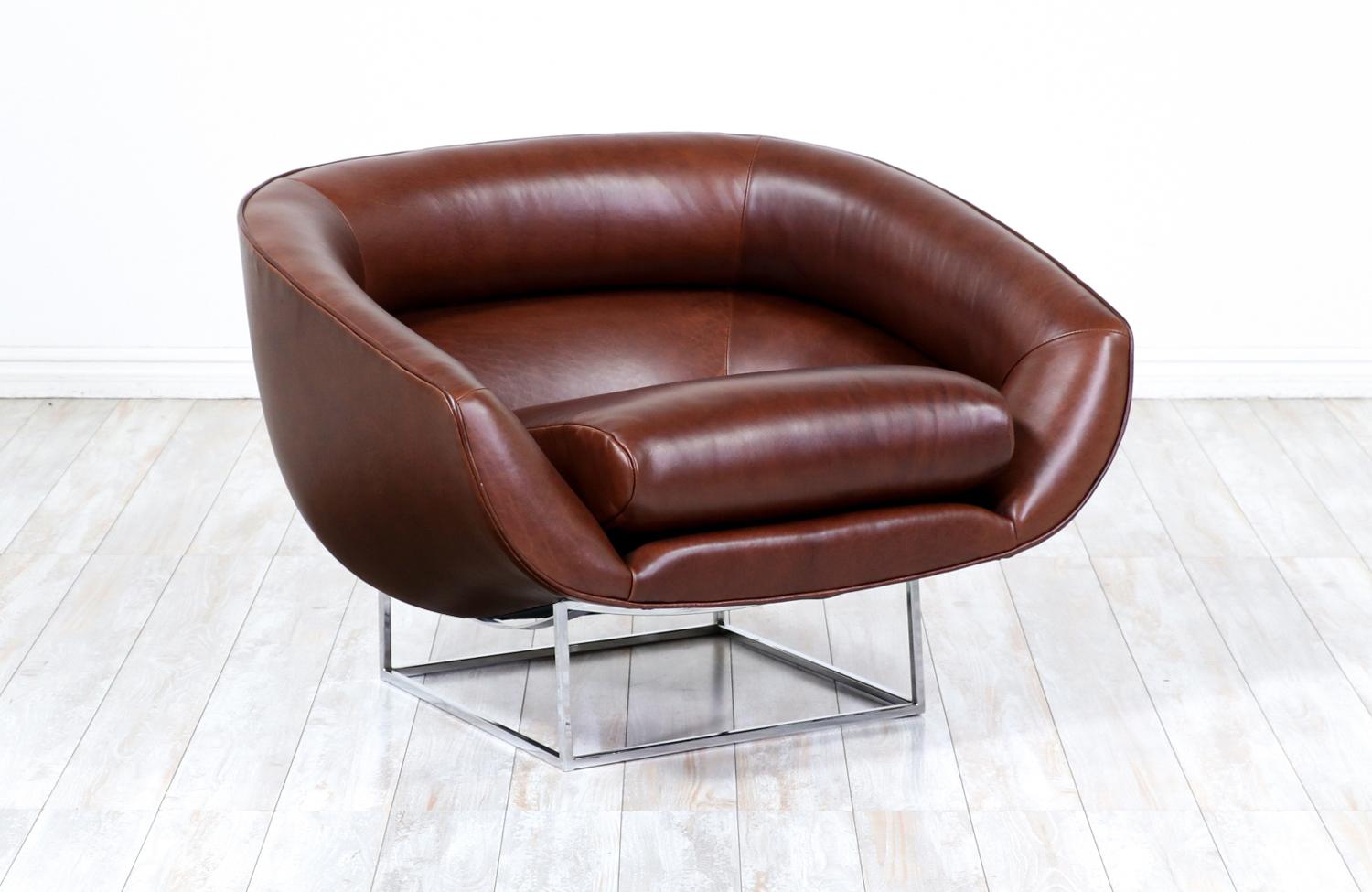 Mid-Century Modern tub chair designed by Milo Baughman for Thayer Coggin in the United States circa 1970’s. This comfortable, unique design features a reupholstered in Italian full-grain leather seat in a distressed cognac tone that contrasts nicely