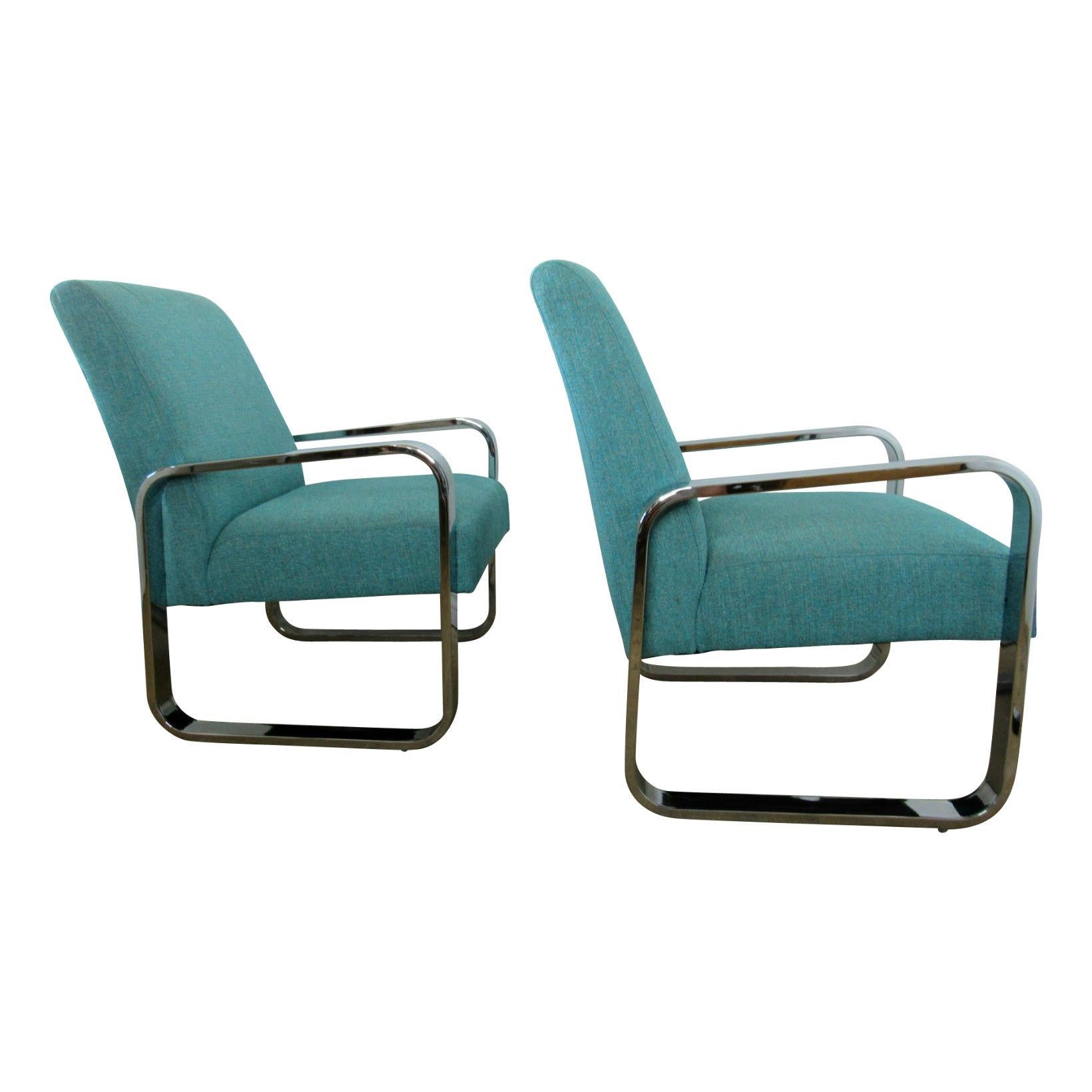 Pair of Milo Baughman sleek flat-bar chromed lounge chairs upholstered in cornflower blue chambray.