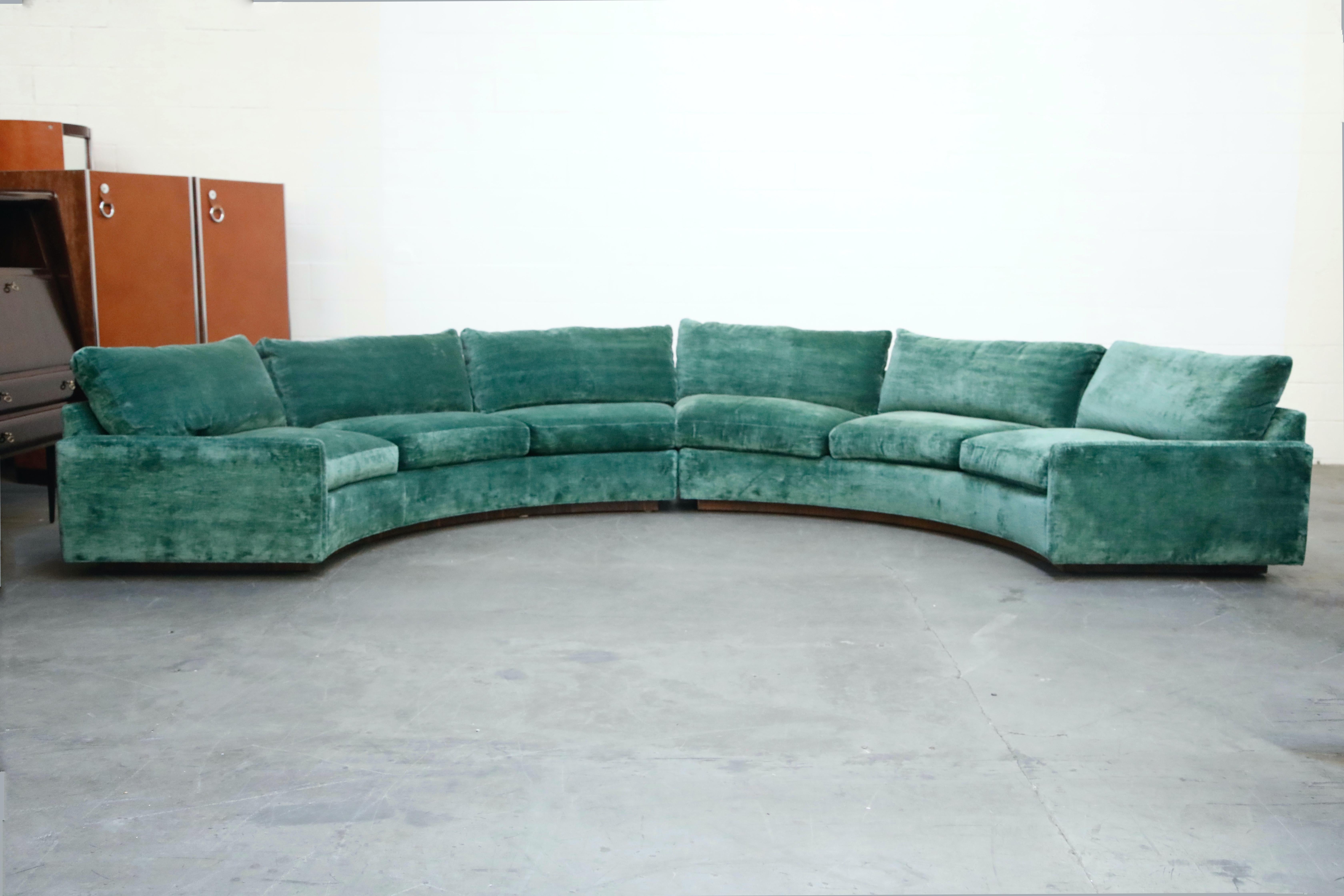 Extremely comfortable and increasingly rare, this large two piece sectional by Milo Baughman for Thayer Coggin, 1960s, features a curved semi-circle design on Rosewood plinth base. This example has been reupholstered in recent years in a teal