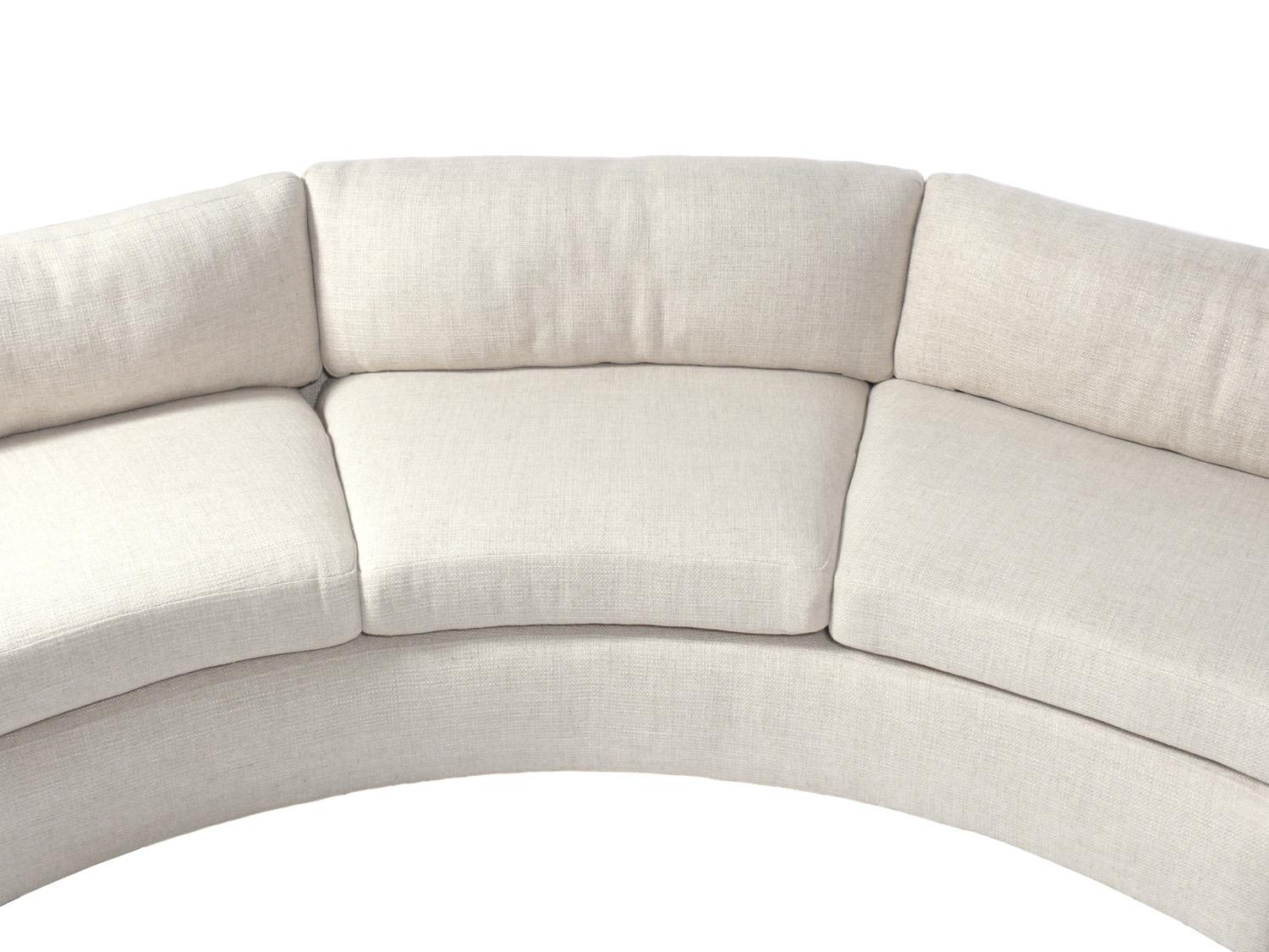 Large scale curved sectional sofa, designed by Milo Baughman for Thayer Coggin, American, circa 1960s. Reupholstered in a sumptuous Pierre Frey ivory color linen style fabric. It is a two section sofa for easier moving.

It measures 164