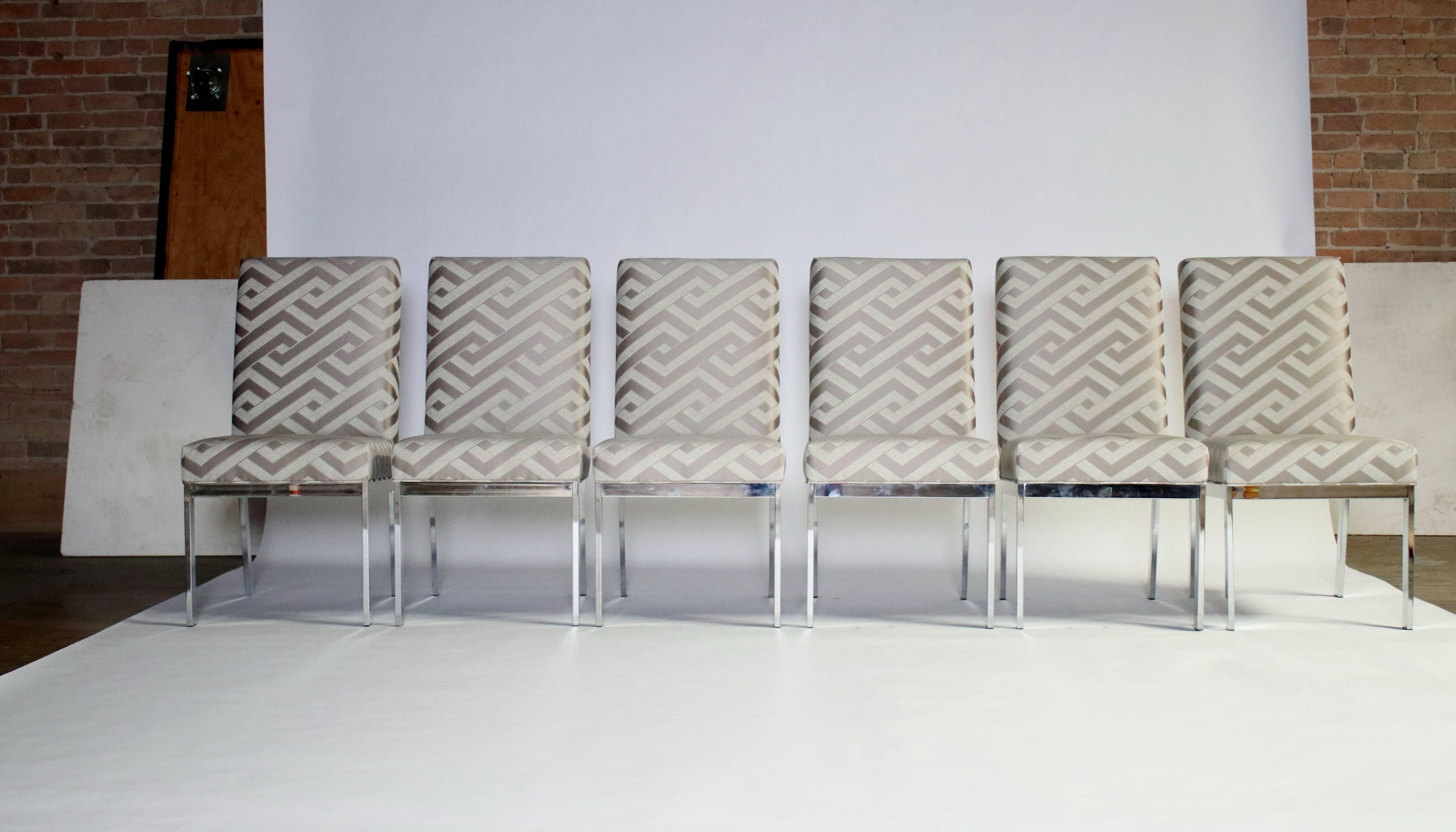 Set of six 1970s dining chairs for Design Institute of America newly upholstered in a platinum and cream geometric Holly Hunt fabric. Dated 1975, labelled.