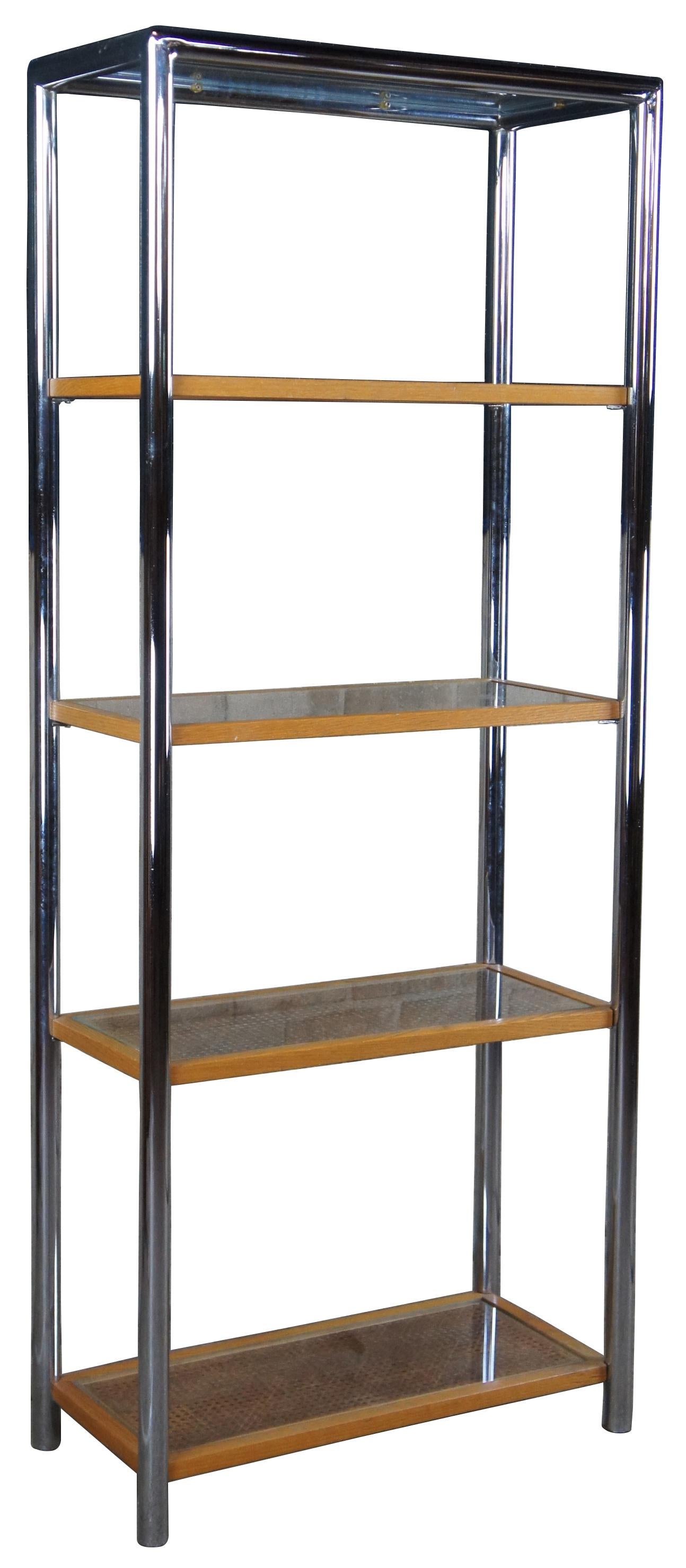 Vintage 1970s Milo Baughman for Design Institute etagere. Made of tubular chrome featuring caned shelves protected by glass.
 