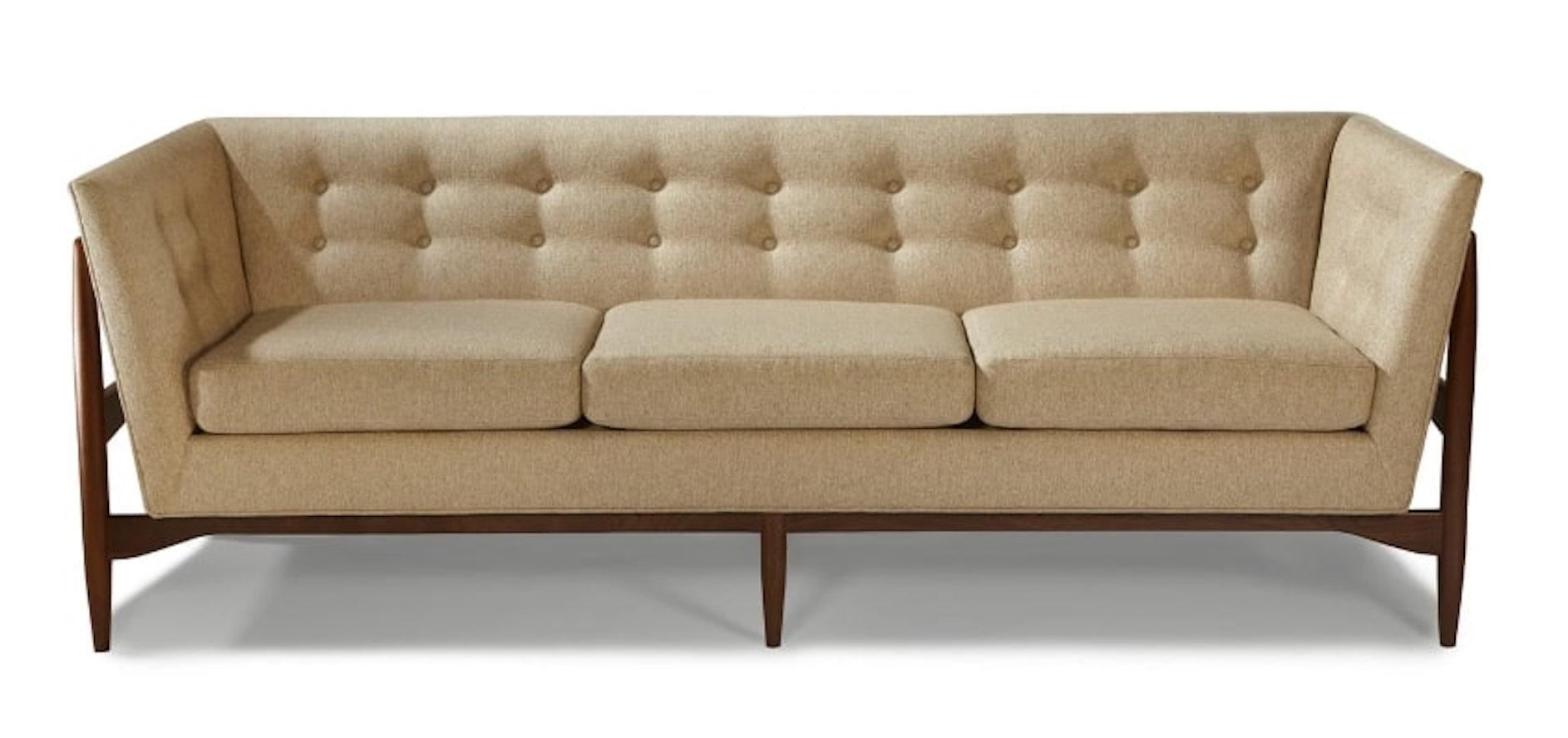 Button Up sofa features button tufting and a solid walnut wood base that is exposed for dramatic flair. Designed by Milo Baughman in 1959, this sofa holds its modern style in today's home.
This is a custom order item, and not in stock.
Please